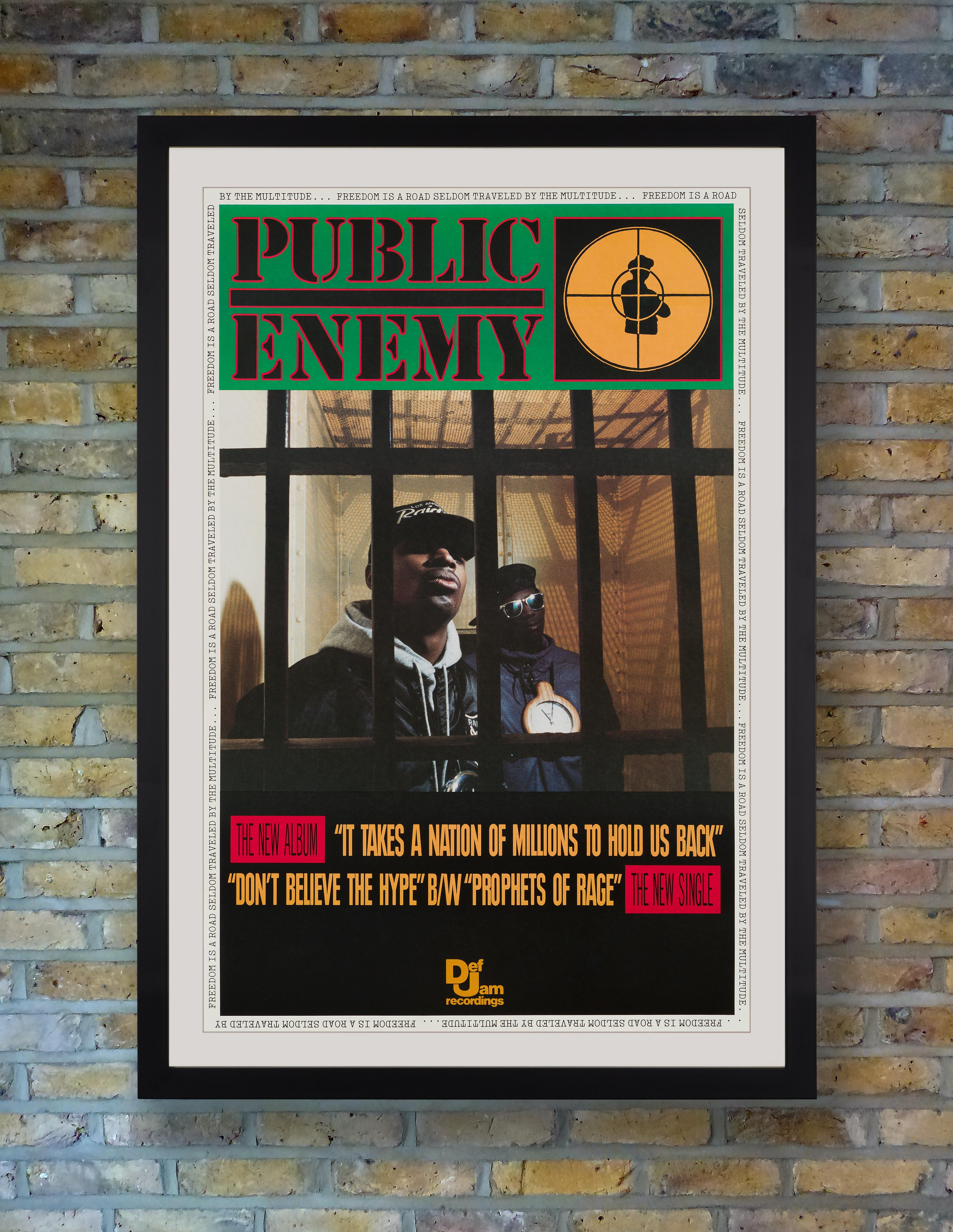 Prolific American hip-hop group Public Enemy's Chuck D and Flavor Flav appear behind bars in a photograph by Glen E. Friedman on this sought after original Def Jam promotional poster for the 1988 release of their seminal second album 'It Takes a