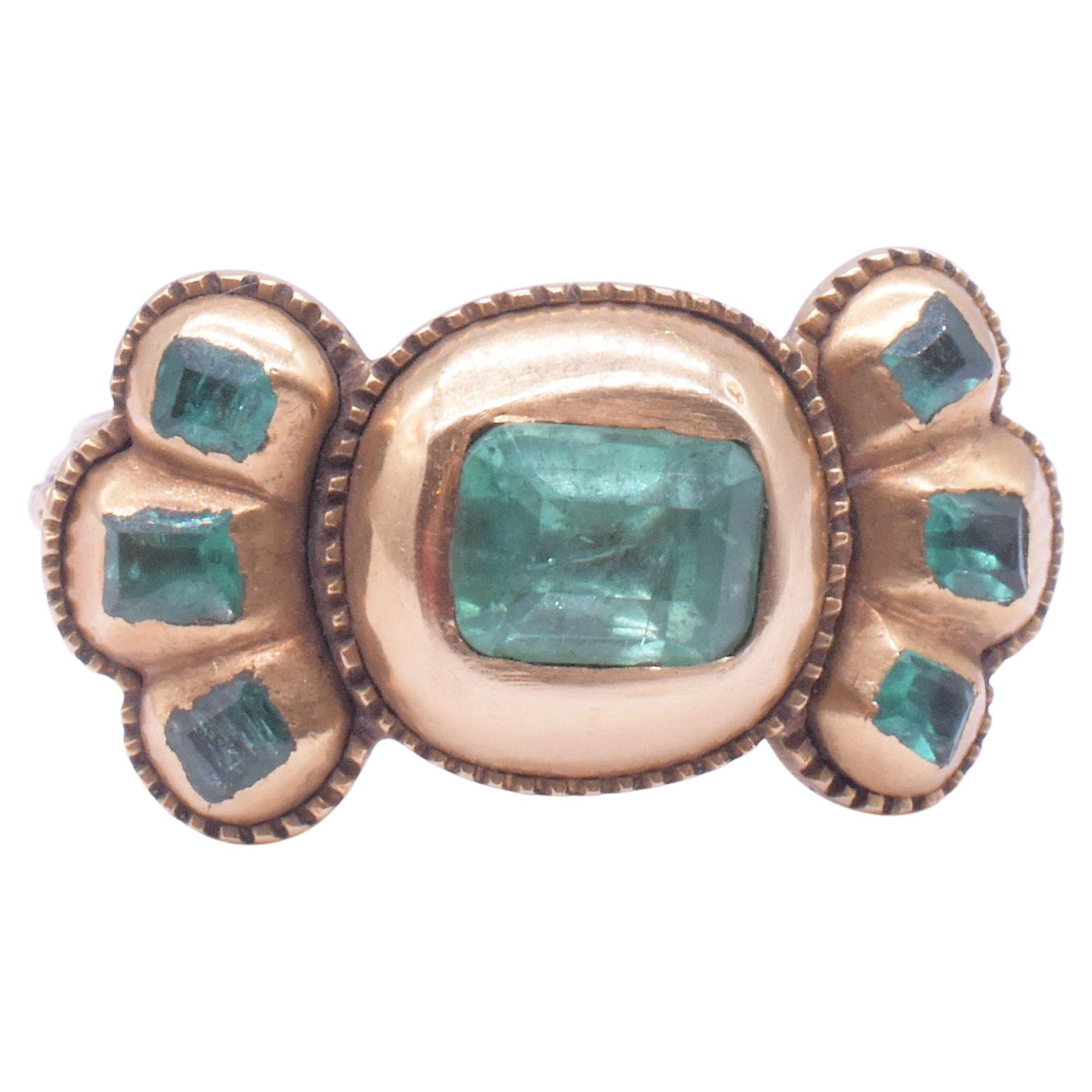 Stuart C1690 Iberian 7 Stone Table Cut Emerald Bow Form Ring For Sale