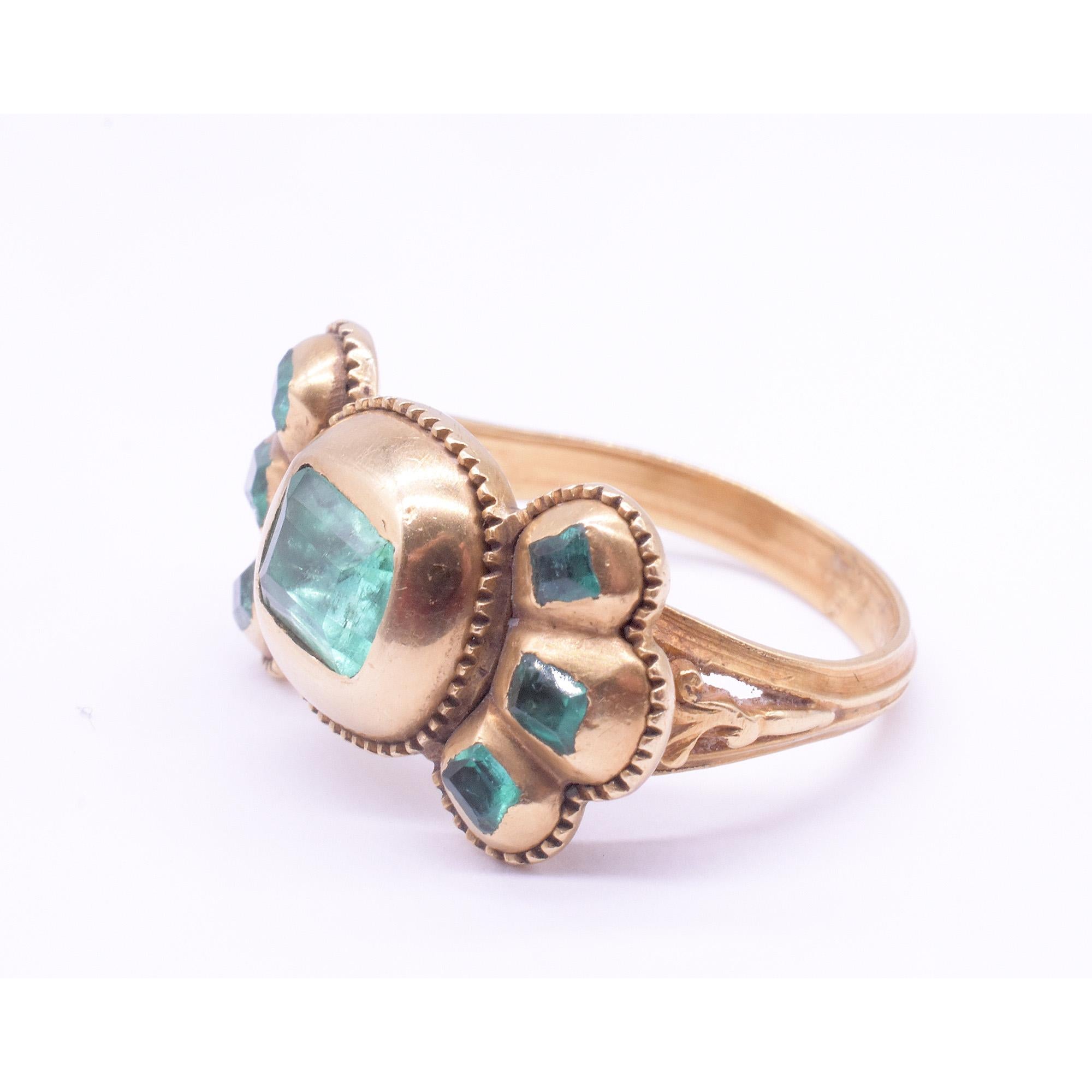 C1690 Iberian 7 Stone Table Cut Emerald Bow Form Ring In Excellent Condition For Sale In Baltimore, MD