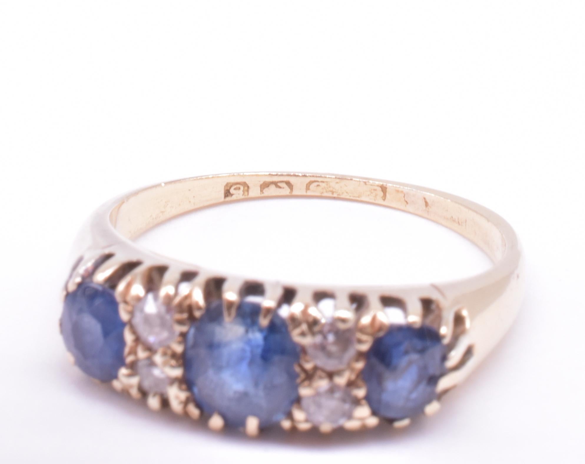 Sapphire ring with three large old mine diamonds and Ceylon sapphires, a variation of the 5 stone half hoop diamond ring ( the pair of diamonds read as one larger diamond) to show emphasis on the gemstones. The ring is set 