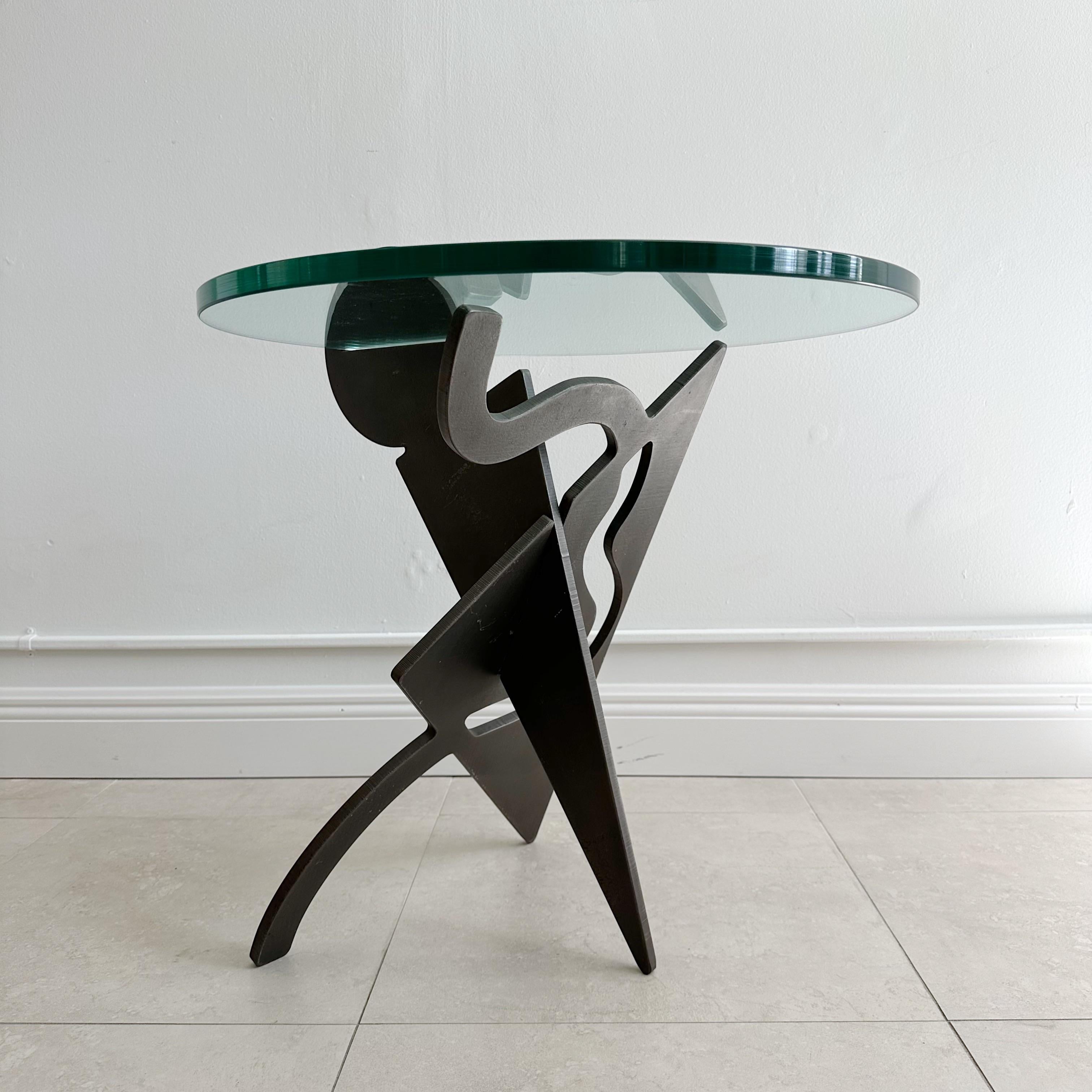 Pucci De Rossi
(1947-2013)
Occasional table with two interlocking panels of ⅝” thick steel cut into abstract forms with one piece of 3/4