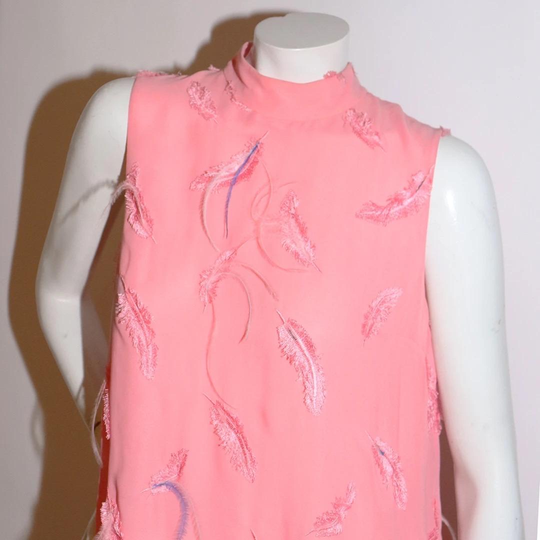 Emilio Pucci Shift Dress
Resort 2021 
Made in Italy 
Light Pink 
Feather details arranged throughout dress 
Embroidered feather details throughout dress 
Mock neck collar 
Three buttons on back of neckline for closure 
Fabric composition; 78%