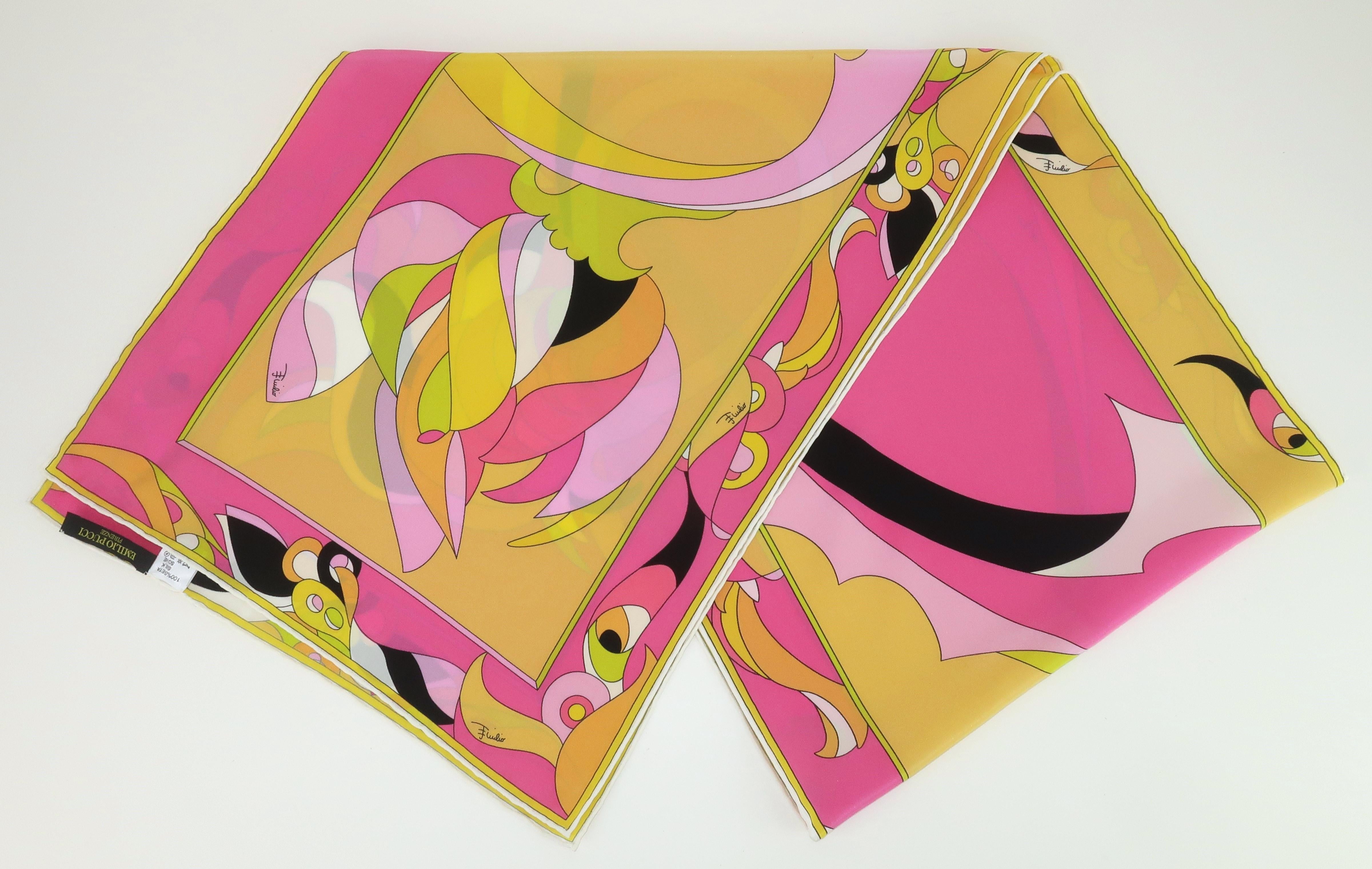 Fabulous long silk scarf in an iconic Emilio Pucci print incorporating shades of saffron yellow, hot pink, bubblegum pink, chartreuse, green and cantaloupe orange mixed with a mod pop of black and white.  The psychedelic print includes a subtle