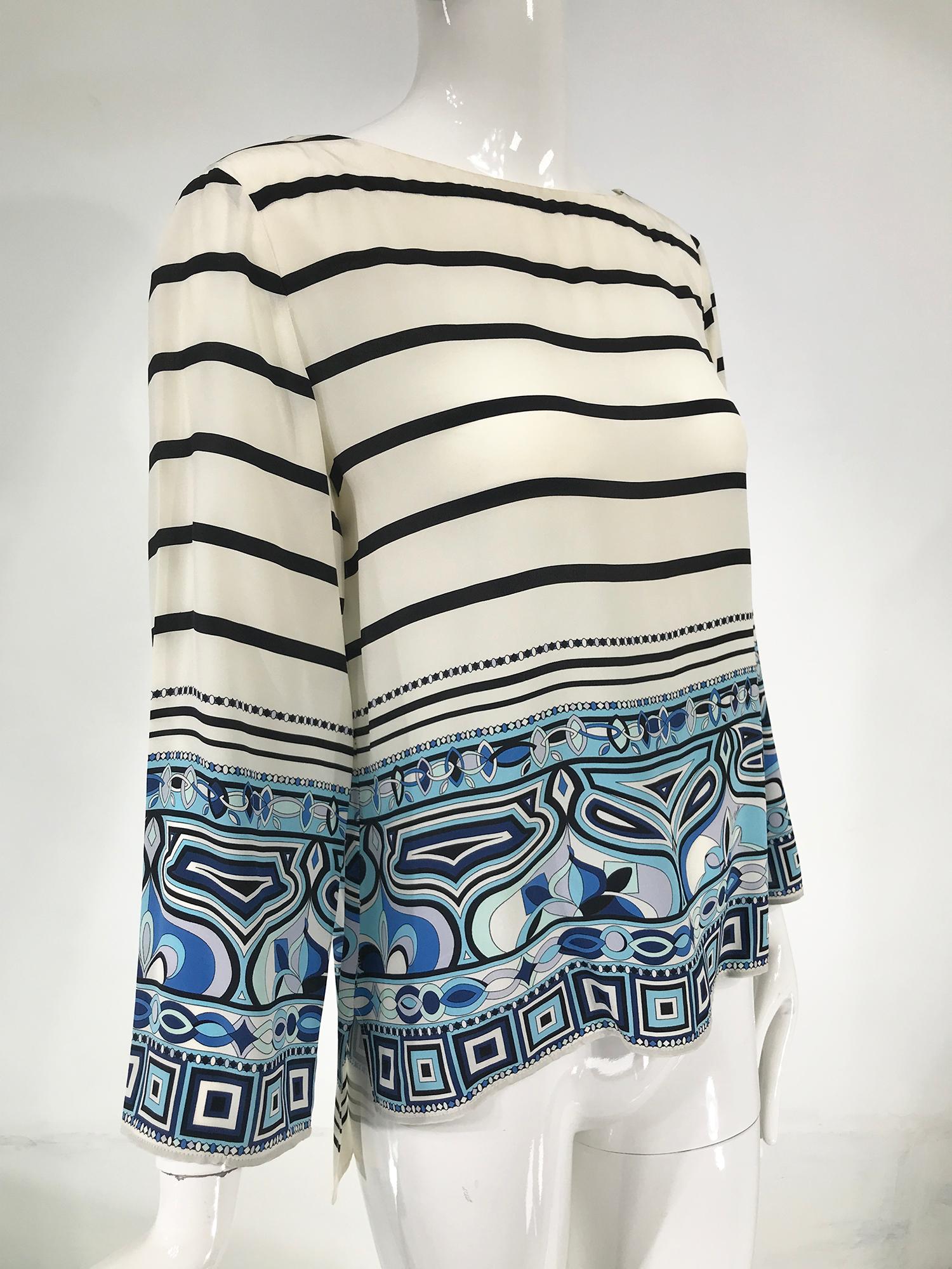 Pucci off white bateau neck black striped Pucci border print silk top. Long sleeve black and off white stripe top with a wide hem and sleeve border print in blue, black and off white. Lightweight silk is perfect for summer. Pull on top, the front