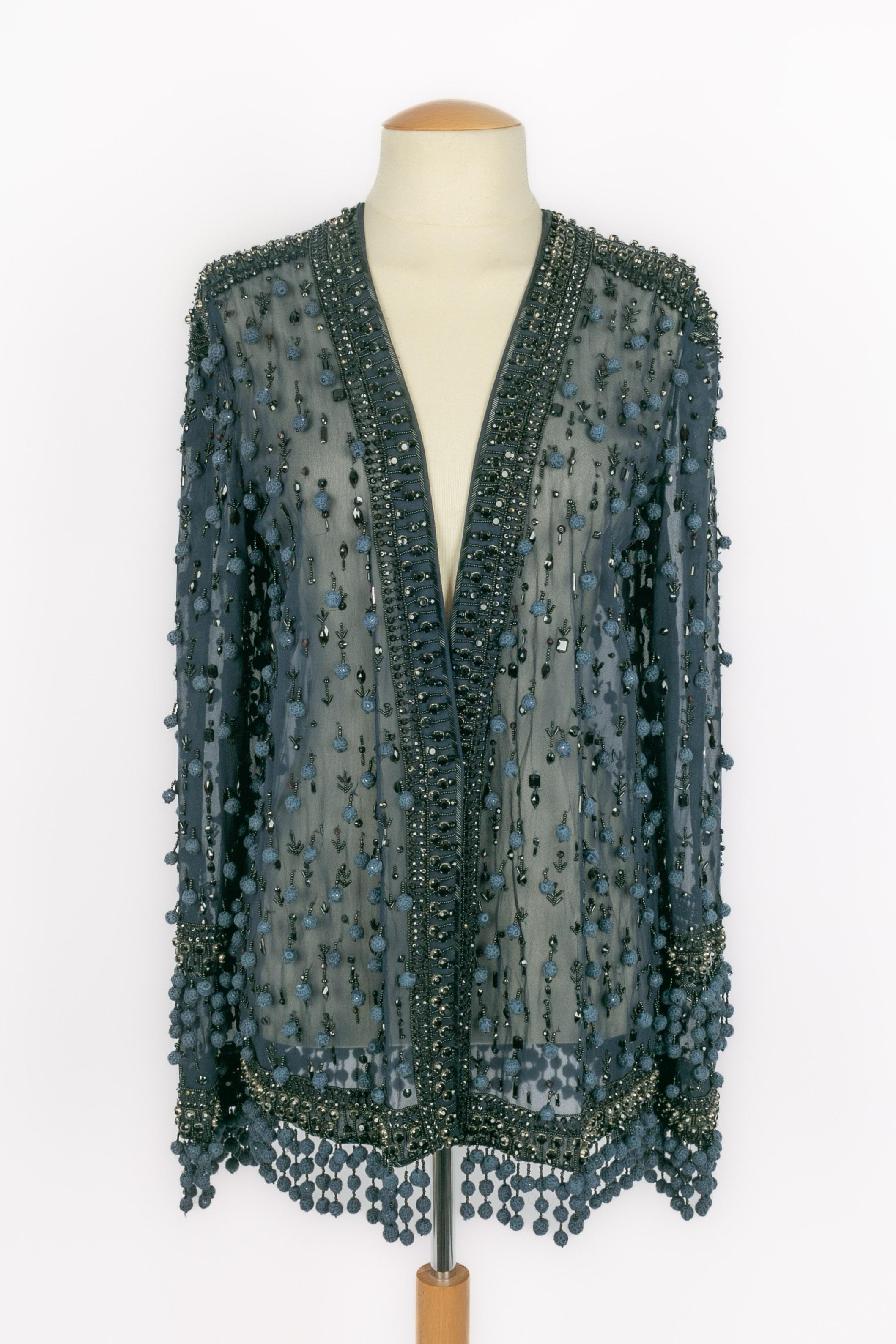 PUCCI - (Made in Italy) Transparent navy-blue silk jacket with long sleeves and sewn with pearls, sequins, and rhinestones. Size 44IT.

Condition:
Very good condition

Dimensions:
Shoulder width: 44 cm - Chest: 44 cm - Sleeve length: 70 cm - Length: