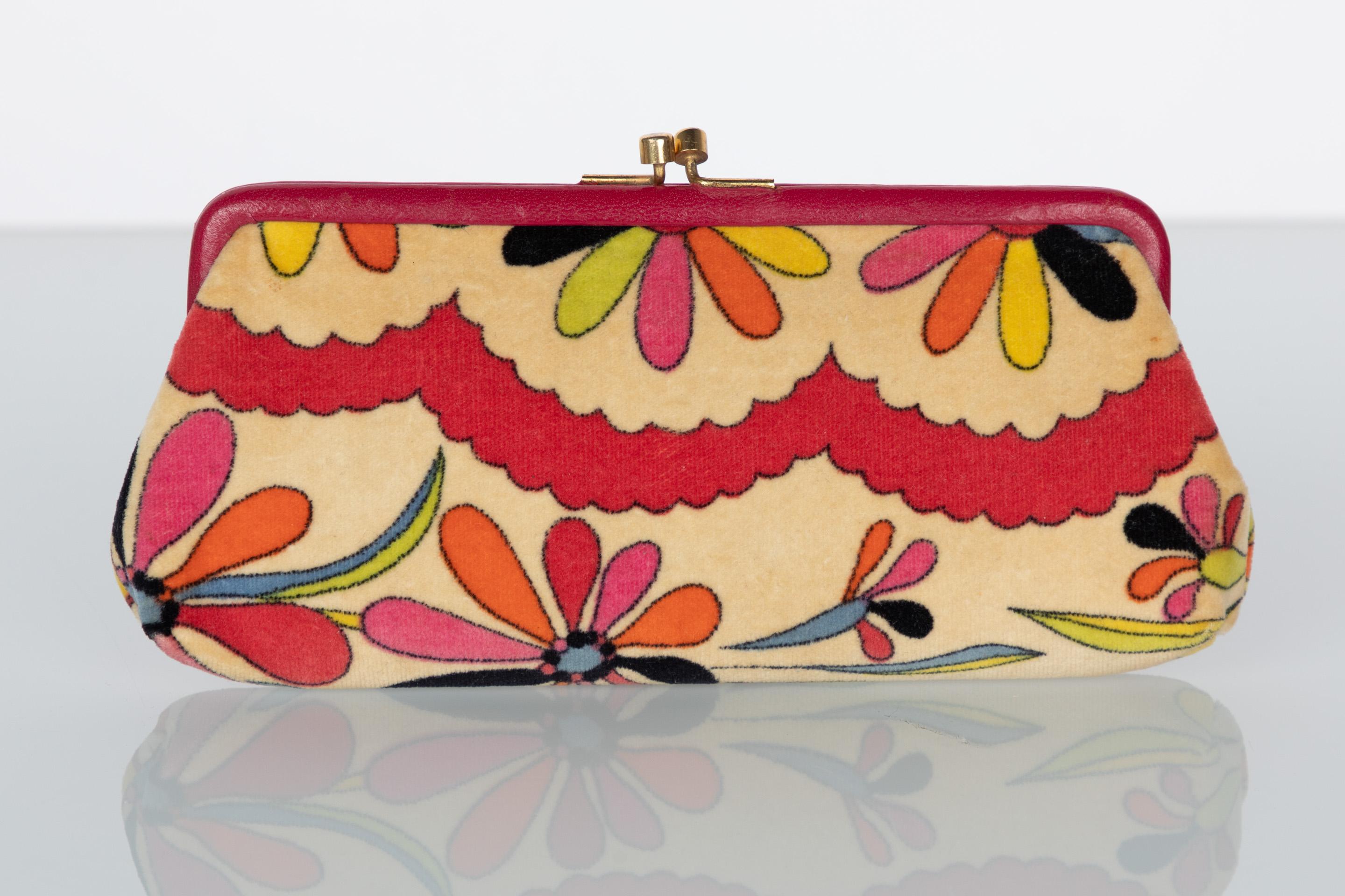 An Emilio Pucci design is easily recognizable for its vibrant and novel prints. Through these colorful prints, Pucci channels a youthful energy overflowing with 60s charm. Done in a buff velvet, this circa 1967 Pucci clutch features a stylized