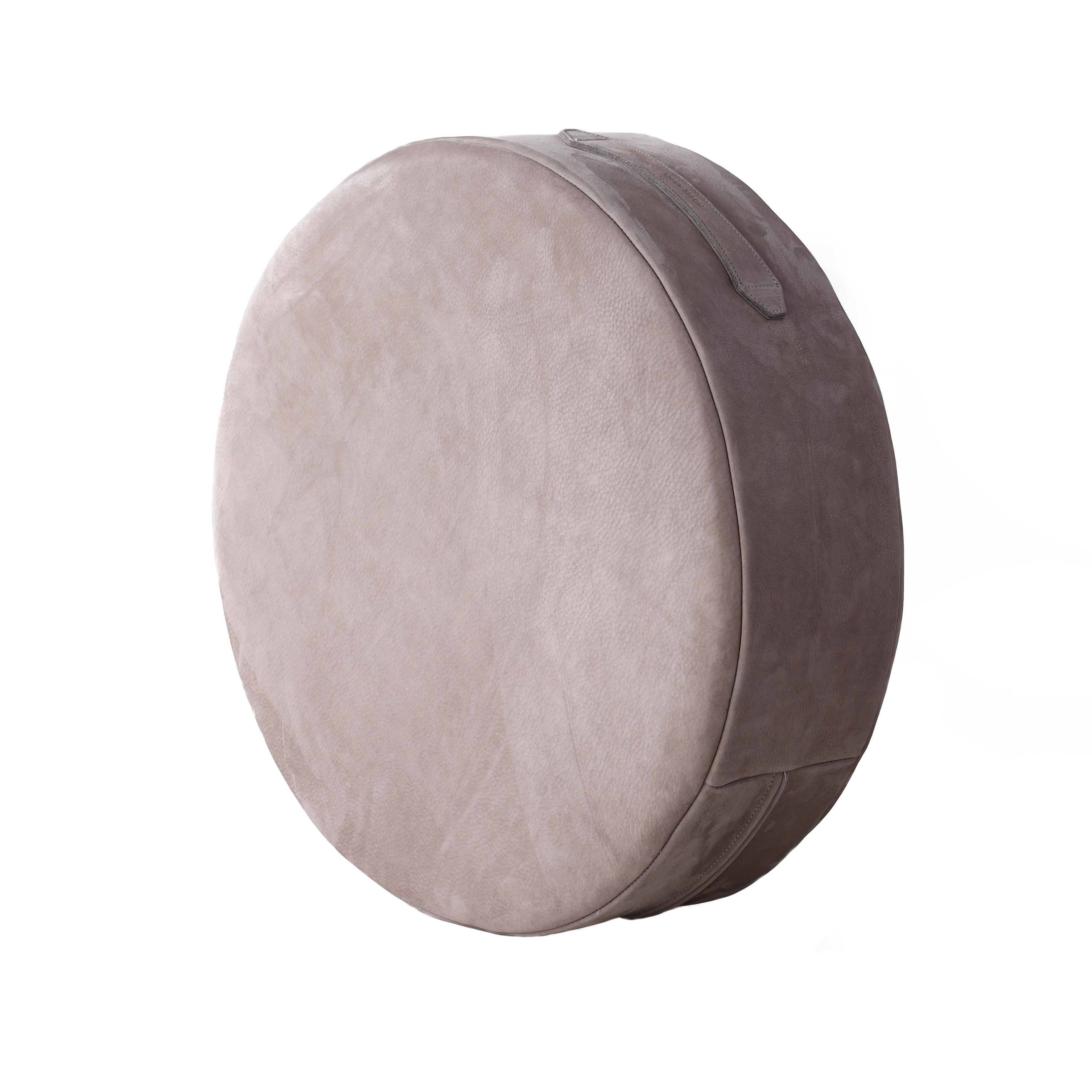 Designed to exude luxury and wake up your space with additional seating, accent decor and cozy chill zones, these low-profile circular shearling floor cushions can be easily moved or stashed away. The Puck Cushion in velvety Nubuck Leather is filled