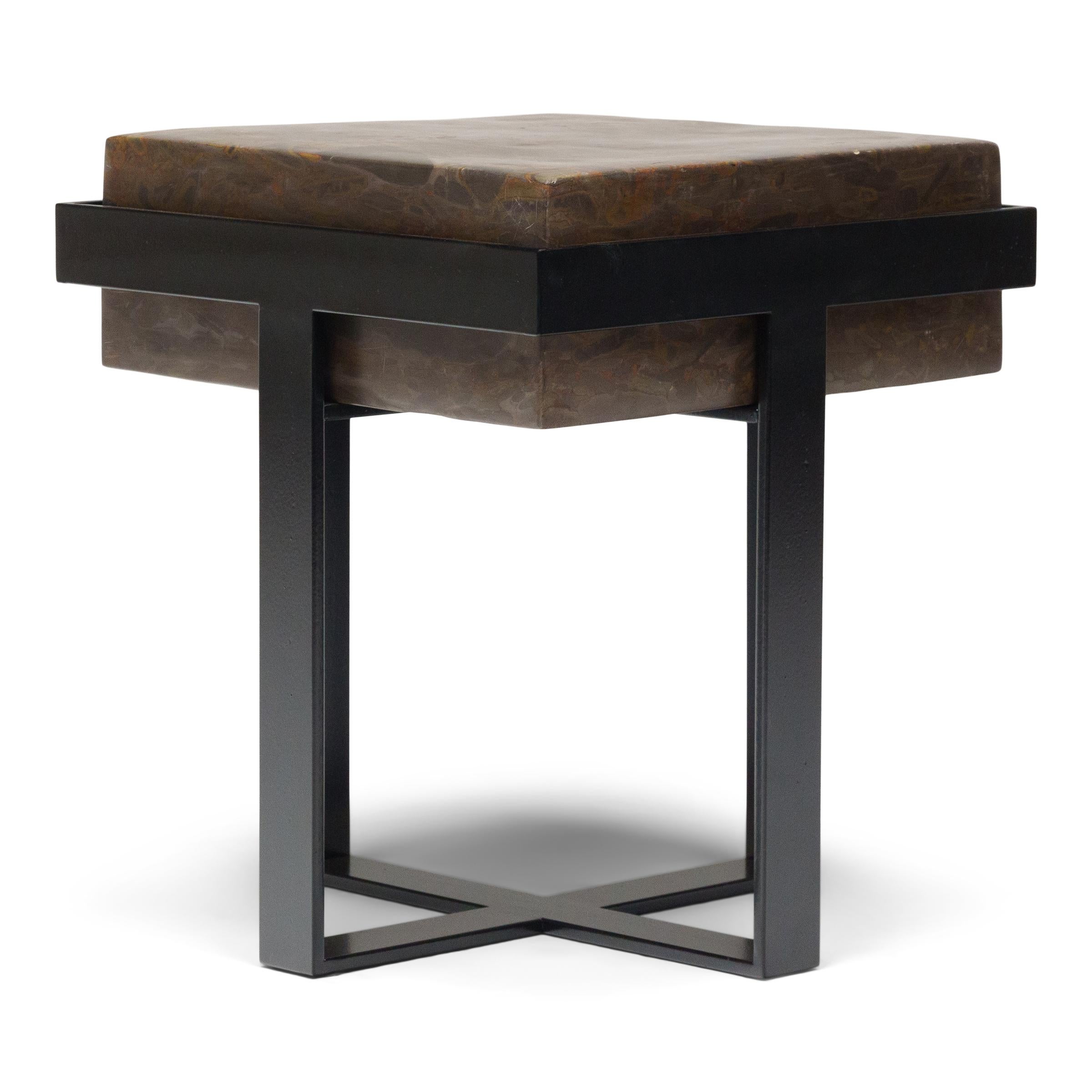 This clean-lined side table is comprised of a square puddingstone top elevated by a powder-coated steel base of modern design. If flipped over, the stone top converts into a round basin, ideal as a catch-all dish or filled with sand for burning