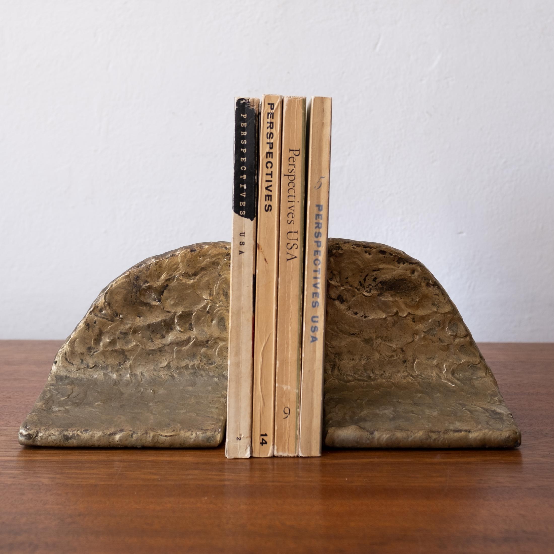 A pair of sculptural puddled bronze bookends. A substantial pair of artist made solid metal bookends, 1960's.