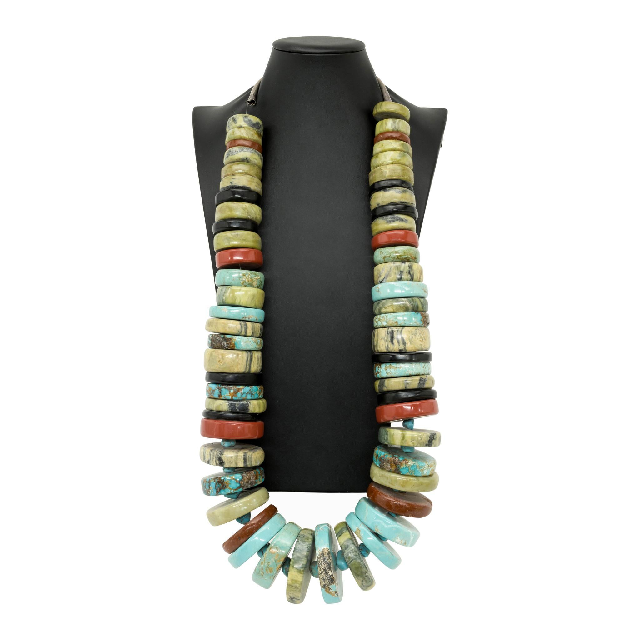Native American Pueblo Indian Chief's necklace. Circa 1900 – 1920. Handmade discs of turquoise, onyx, bloodstone and more. The center discs are interspersed with small turquoise nuggets. Was deaccessioned from a private Museum near Washington D.C.