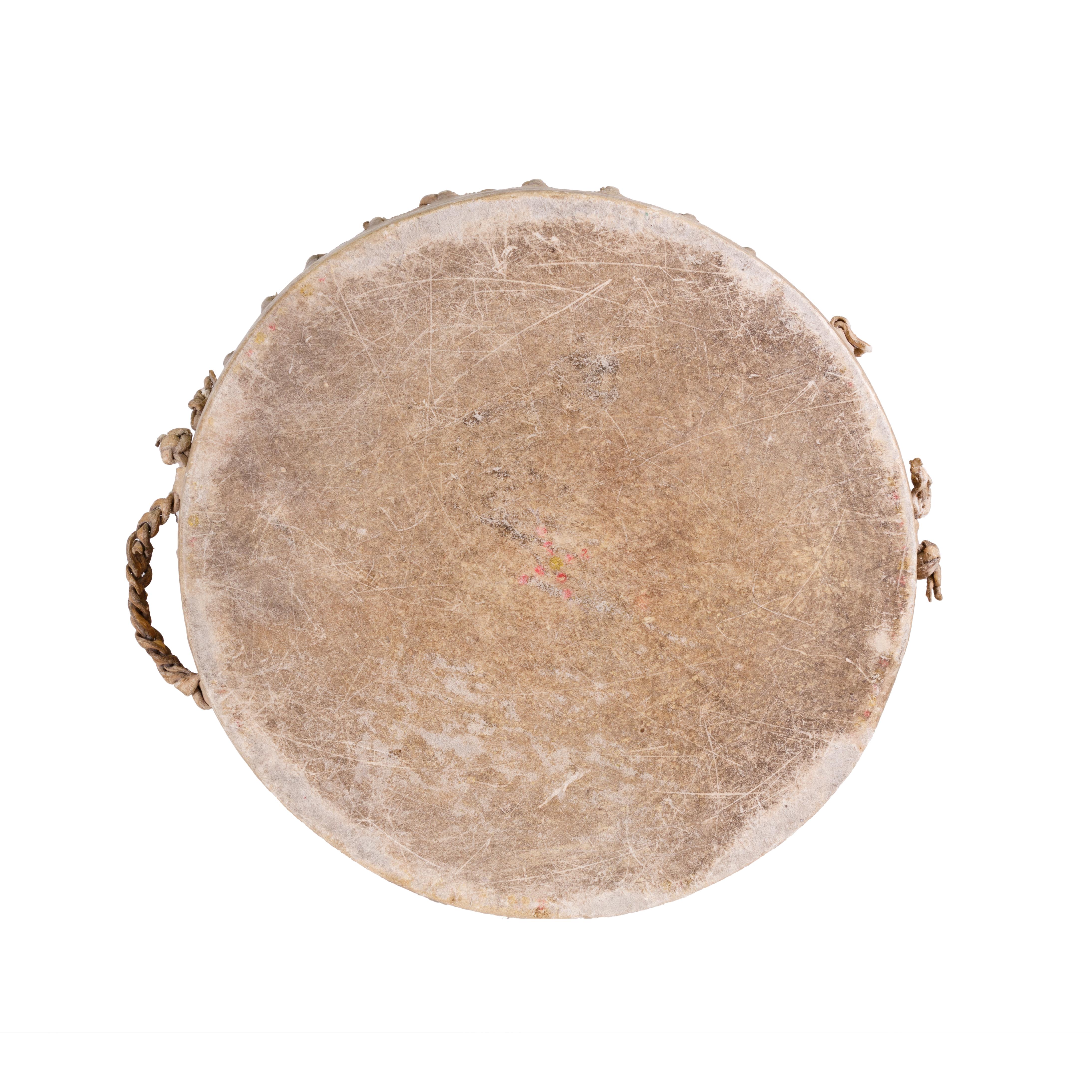 Native American Pueblo drum that has seen use. Acquired by Charles Graves, Indian agent, New Mexico, 1930s. One handle missing (chewed off by his dog).

Period: First quarter 20th century

Origin: Pueblo

Size: 13