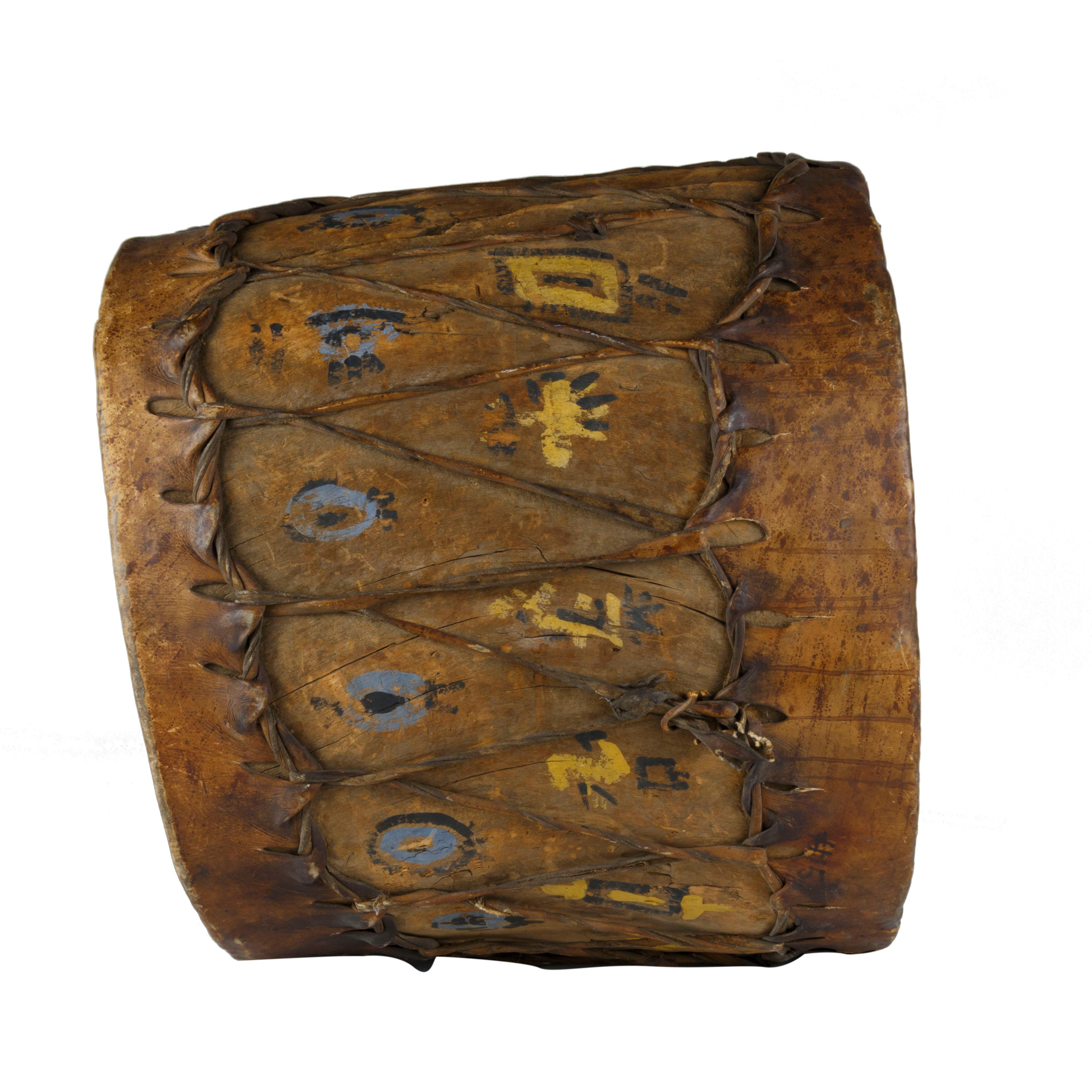 Native American Pueblo Indian cottonwood trunk drum - it's old. Pueblo drum made from a hollowed out cottonwood trunk, old milk paint, - this one's been used.

Period: 19th Century

Origin: Southwest

Size: 21