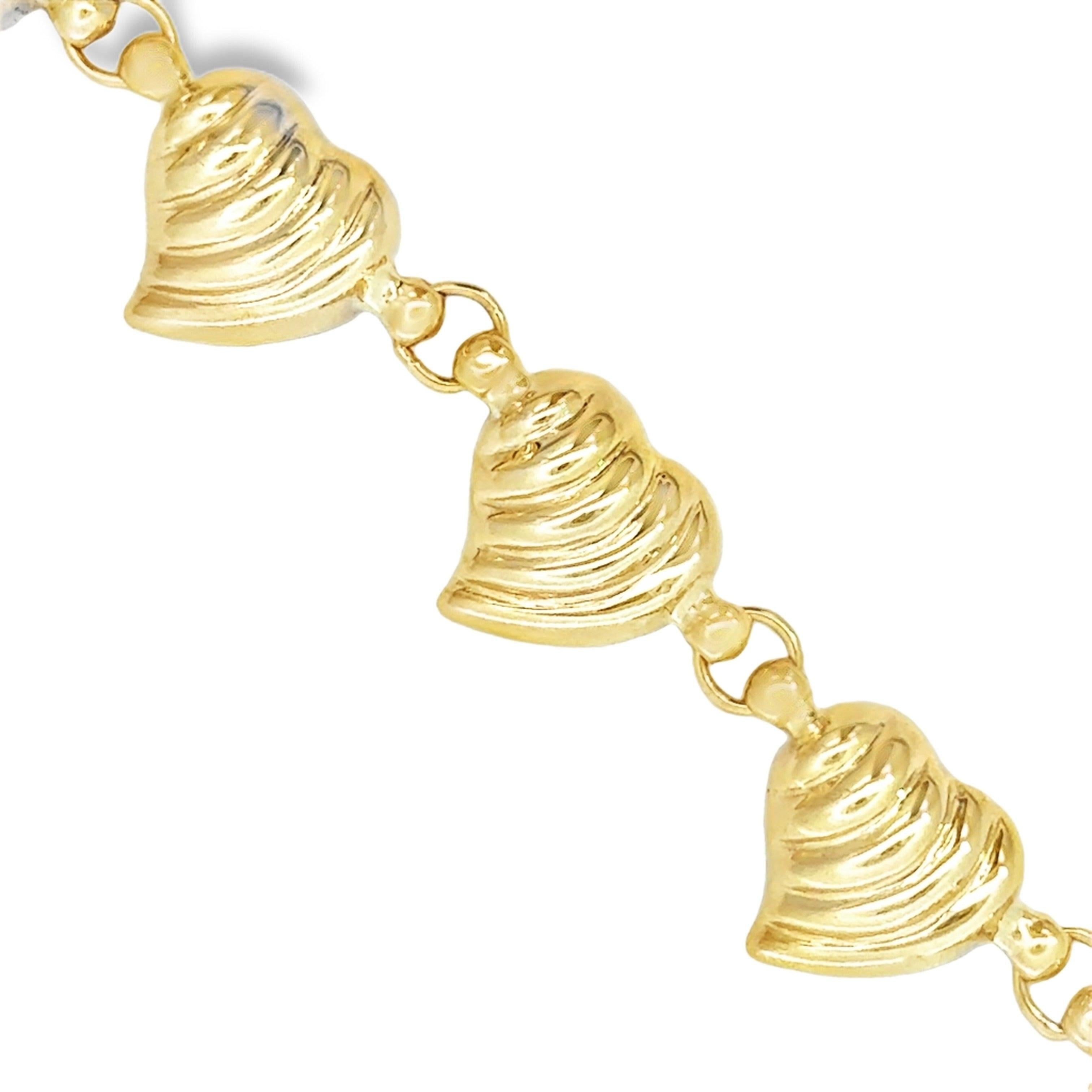 The Puffed Heart 14K Yellow Gold Bracelet combines a delicate puffed heart motif with durable 14K yellow gold, making it an ideal piece for everyday wear. Its elegant design pairs effortlessly with other bracelets, allowing for versatile styling.