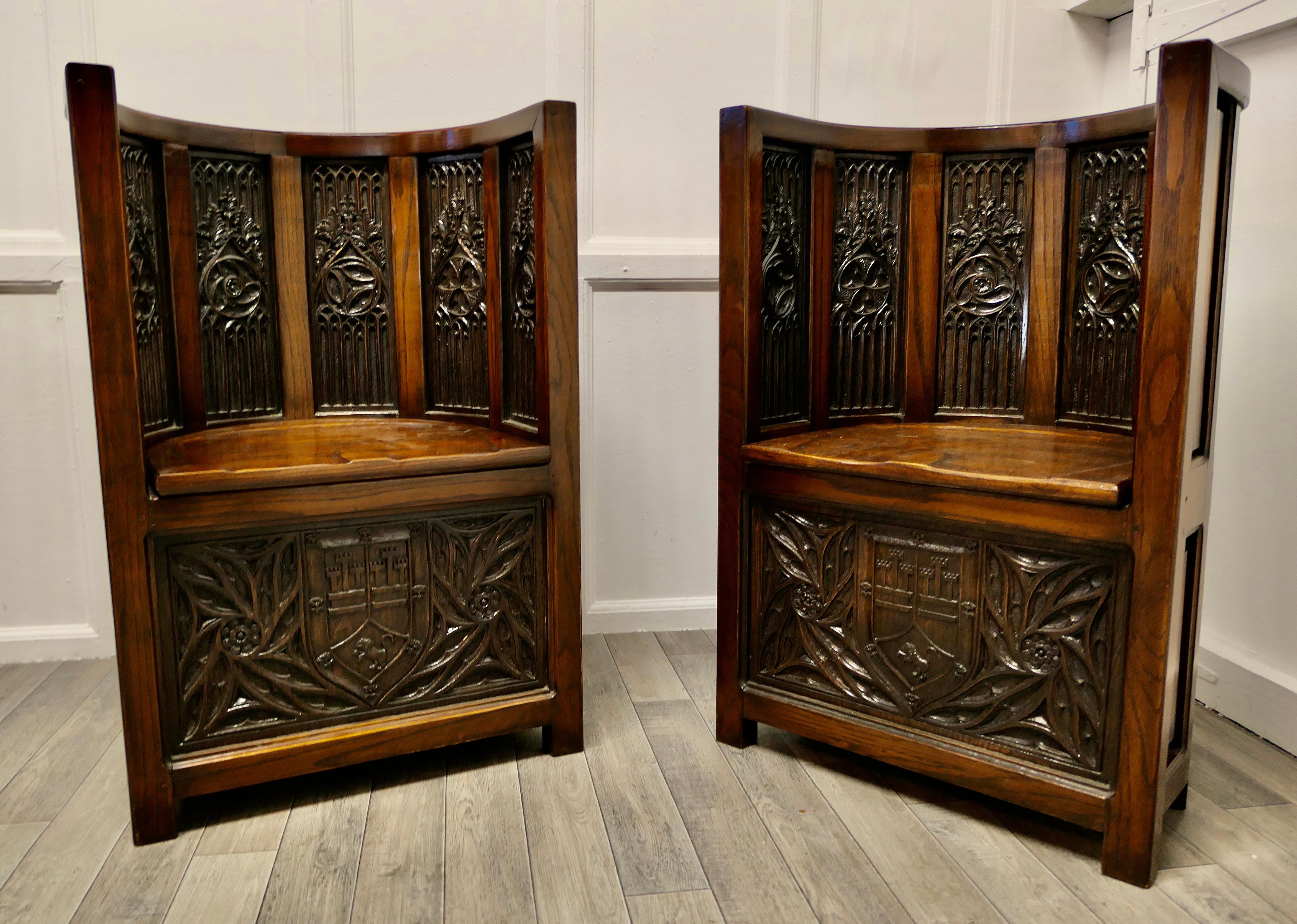 Pugin inspired Arts and Crafts carved barrel back hall chairs.

This is a beautifully designed pair of hall porters chairs from the 19th century Arts and Crafts movement Gothic Revival Style.
The chairs are of the finest quality, they are made in