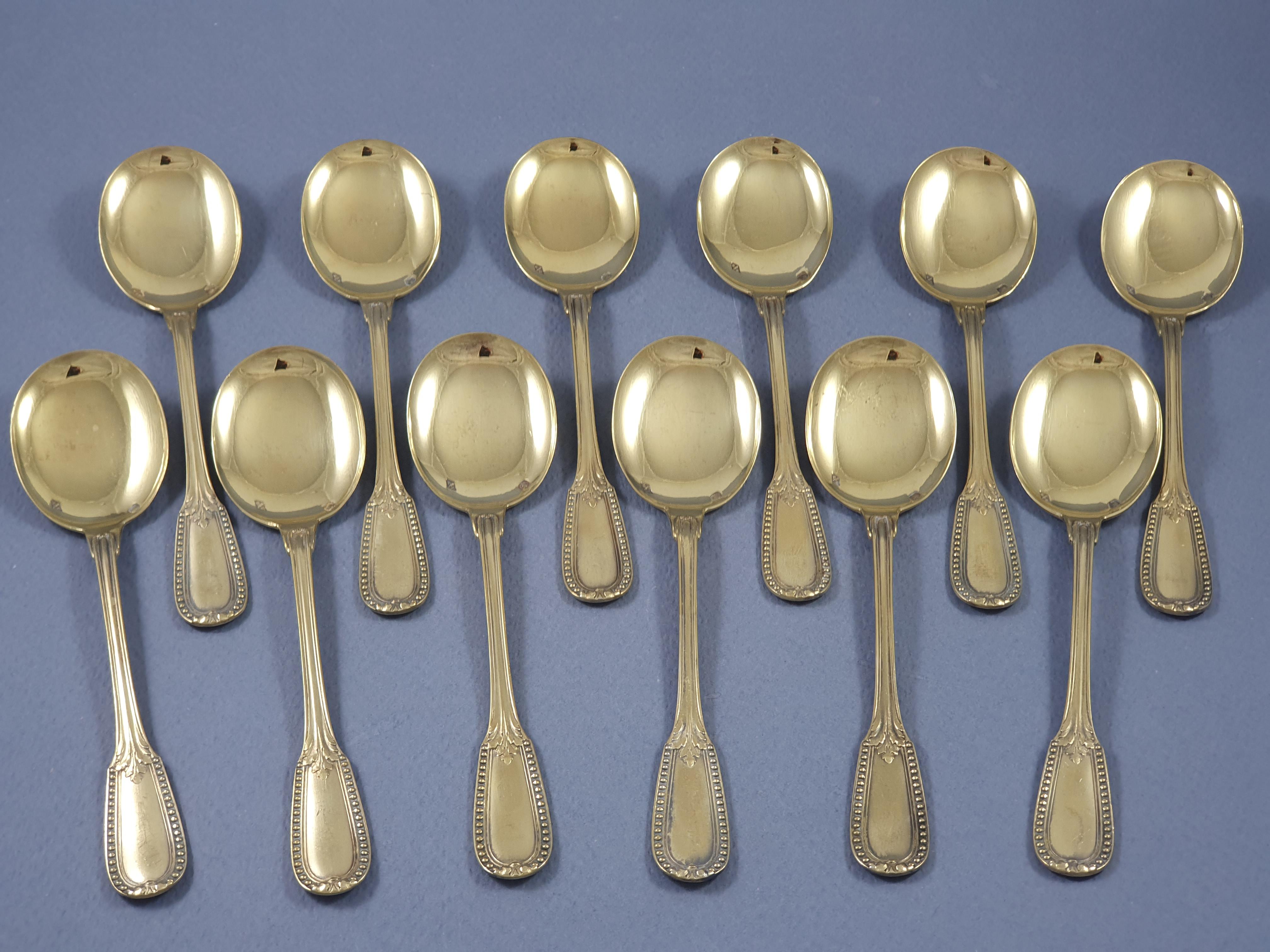 12 Sterling Silver Gilt Ice Cream Spoons

Decorated with friezes of pearls and foliage 

Hallmarked Minerva 1st title for 950/1000 Purity Silver 
Silversmith: Puiforcat 

Length: 12.7 cm 
Weight: 262 grams

Great condition
