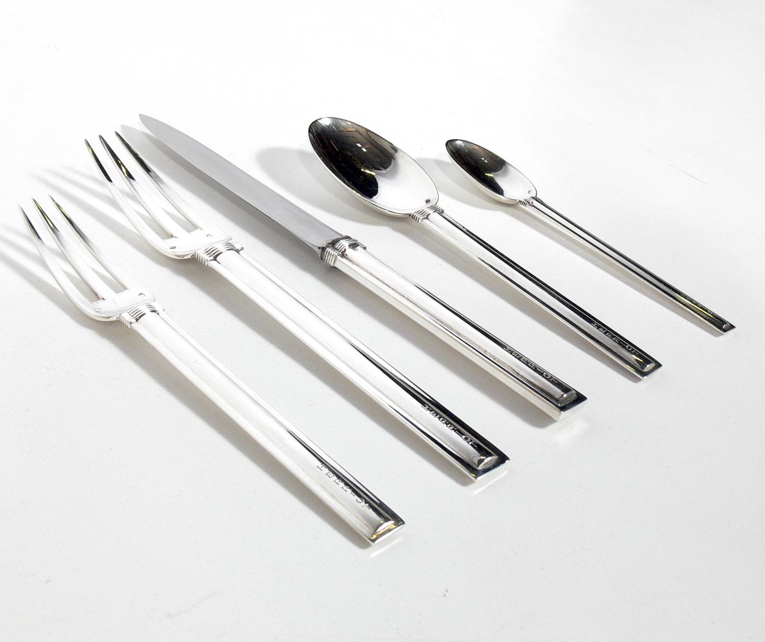 Rare Art Deco “Cannes” pattern silver flatware set, designed by Jean Puiforcat, France, circa 1930s. This set consists of the five pieces as shown. Each piece monogrammed HERRIOT. This can be removed at an additional charge if you prefer.