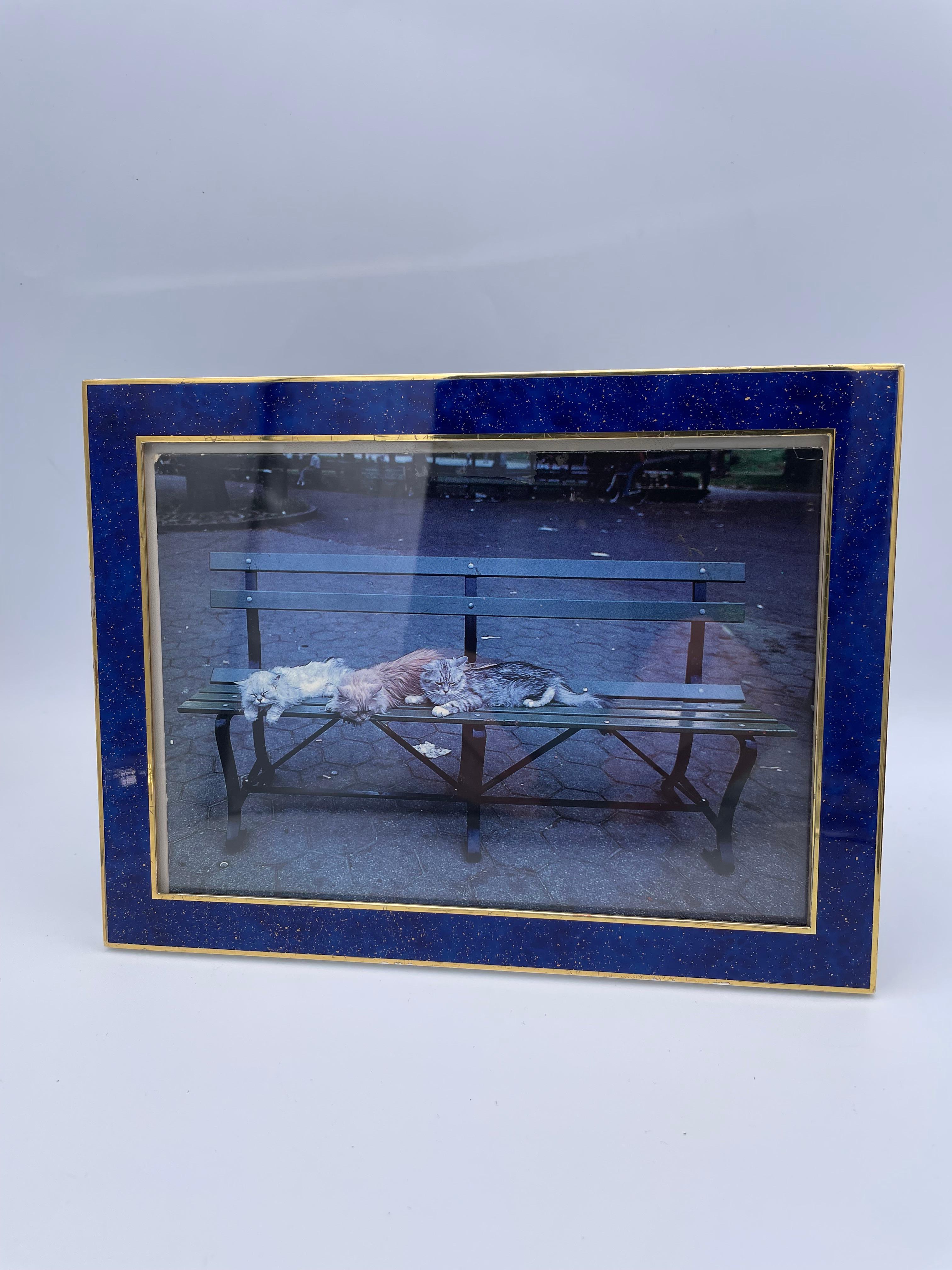 Outstanding enamel picture frame. Made by Puiforcat. A rich intense sapphire blue enamel, flecked with gold. Gives the appearance of lapis lazuli. Set between outside and inside borders of bright gilt metal. Heavy gauge. Overall size is 8