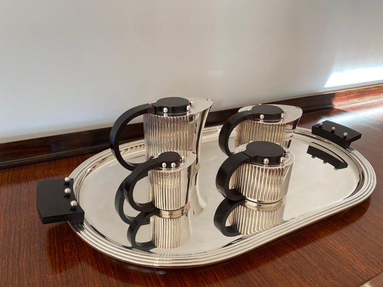 Puiforcat Etchea Art Deco tea and coffee service in silver plated metal and rosewood. The set of five includes:
Oval tray- 27.75
