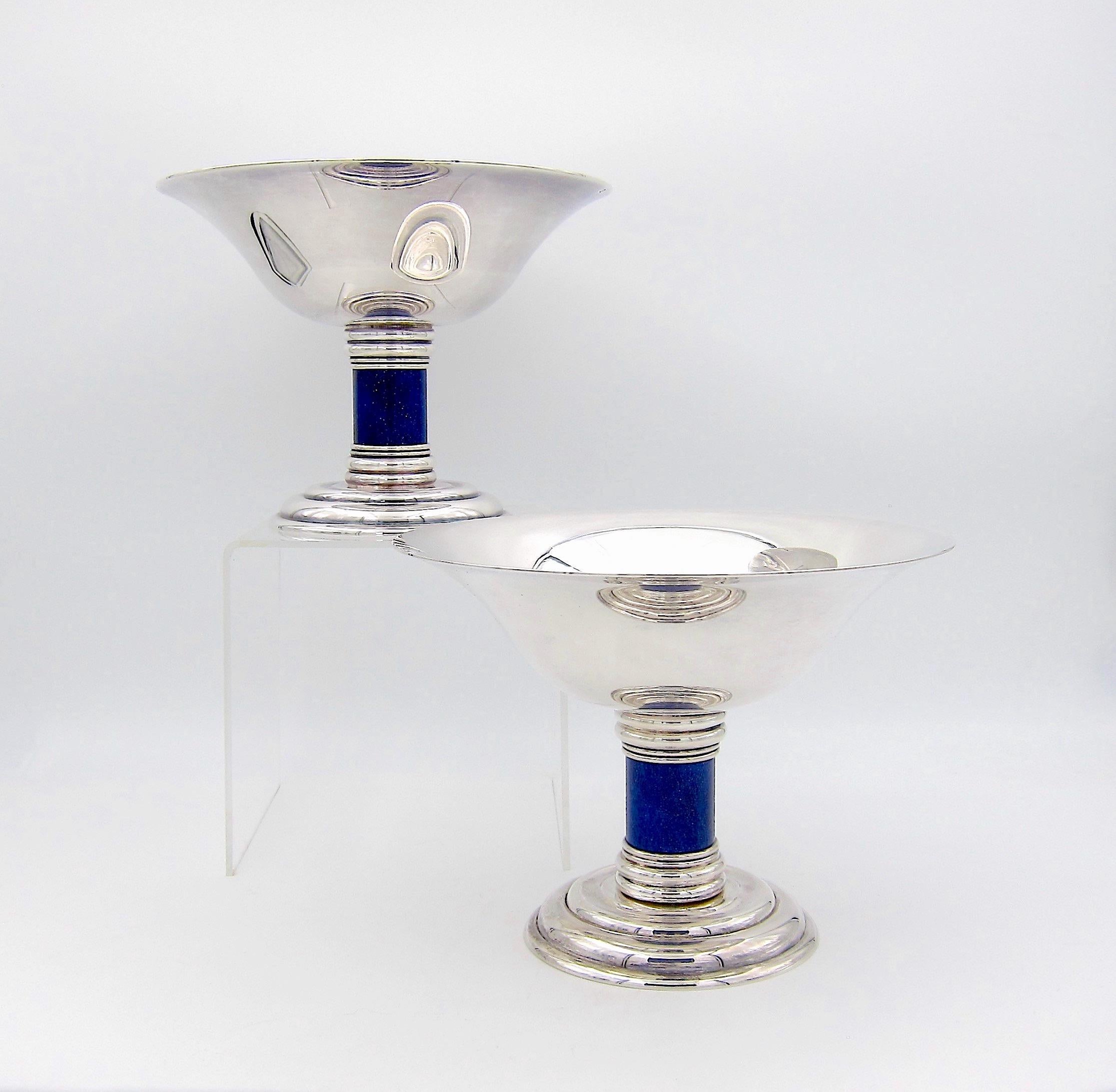 A large and elegant Art Deco compote / tazza pair designed by Jean E. Puiforcat (1897-1945) in the 1930s for renowned French silversmiths Puiforcat of Paris; the firm produced the form for several decades during the 20th century. The silver plated