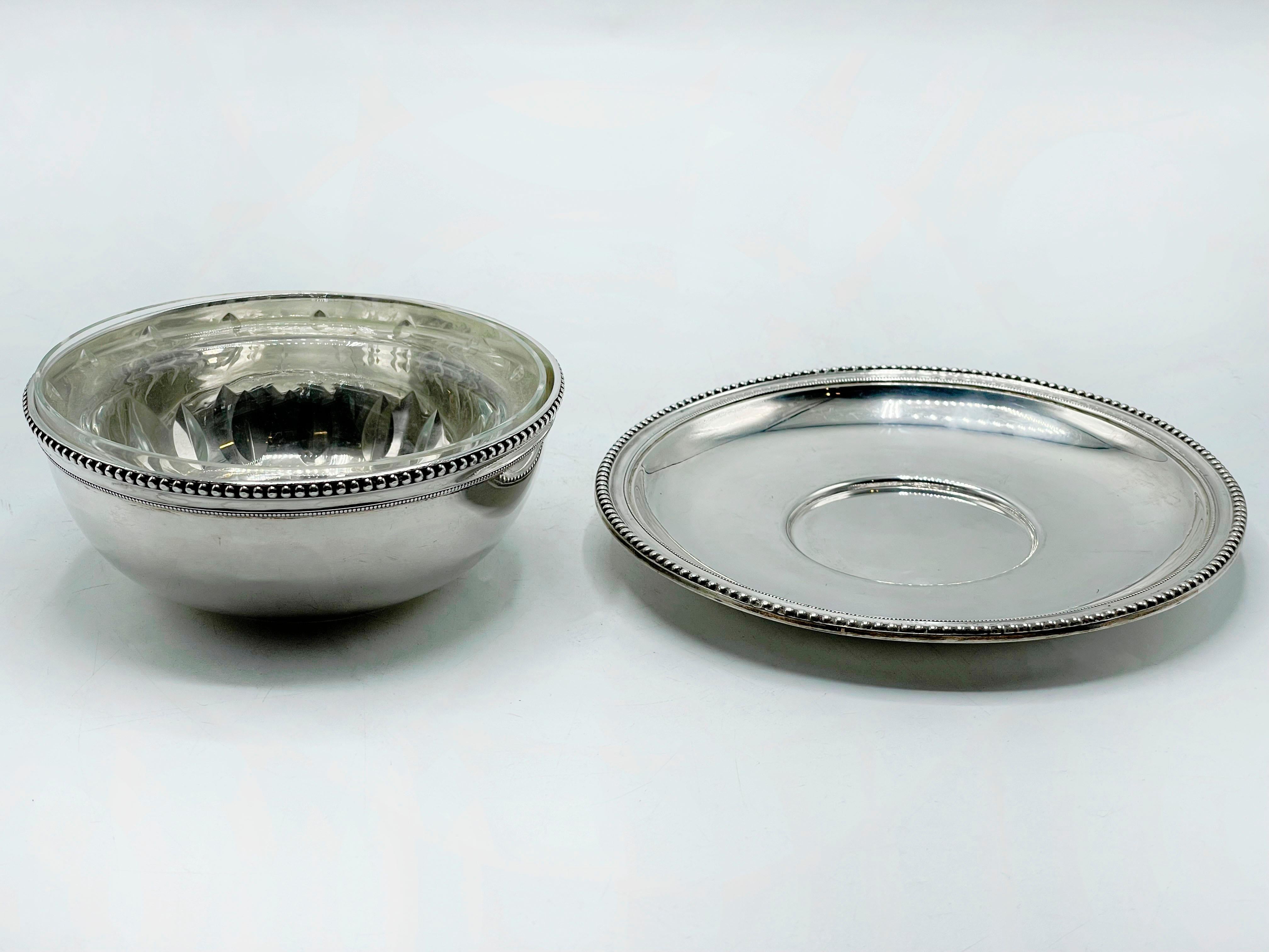 Puiforcat French Sterling Silver Dessert Compote Glass Bowl
Puiforcat, 2 sterling silver French dessert/compostery bowls and plate with a pretty curvilinear design and ornate edges. Each piece has stamps as shown.

Founded in 1820 by Emile