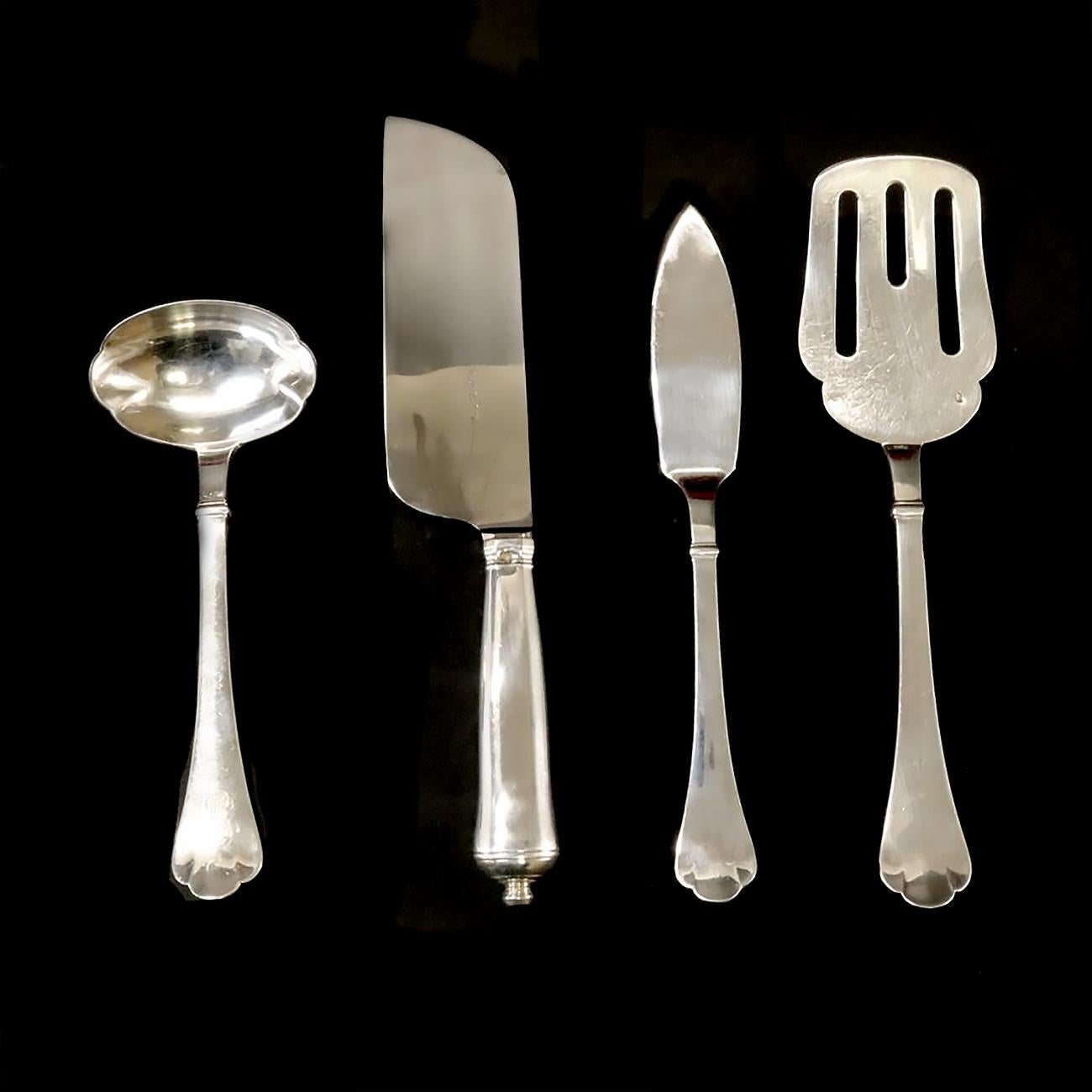 This Puiforcat Solid Silver handmade flatware service is composed of 235 pieces. Classic Richelieu's model is inspired by 17th-century flatware with curved lines, spearhead-shaped reinforcement, and a tri-lobed spatula. Rounded knives are inspired