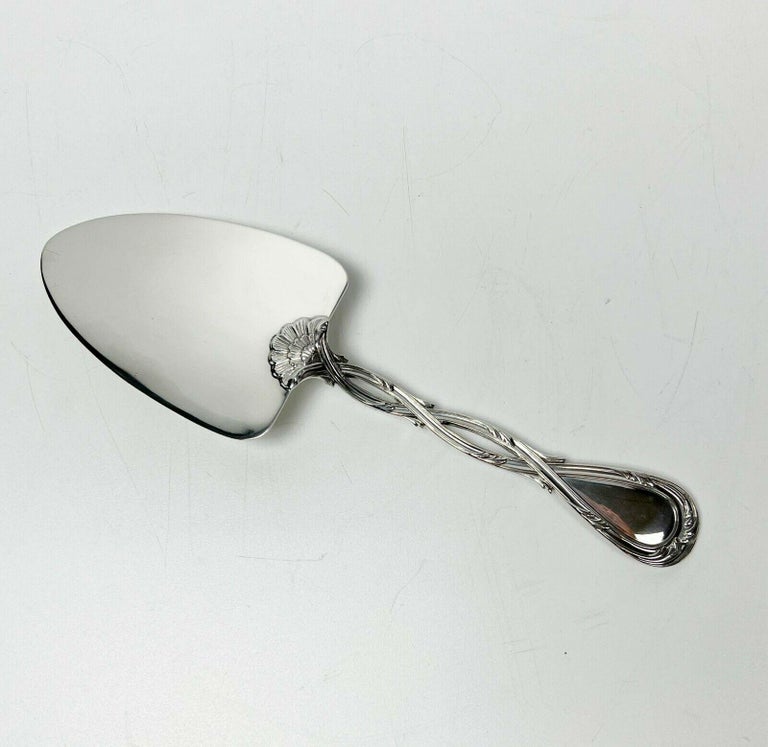 Puiforcat French Sterling Silver Pastry Server in Royal

An elegant pierced intertwined handle. French silver hallmarks to the base and marked Puiforcat to the side of the handle. 

Additional Information:
Composition: Sterling Silver 
Brand: