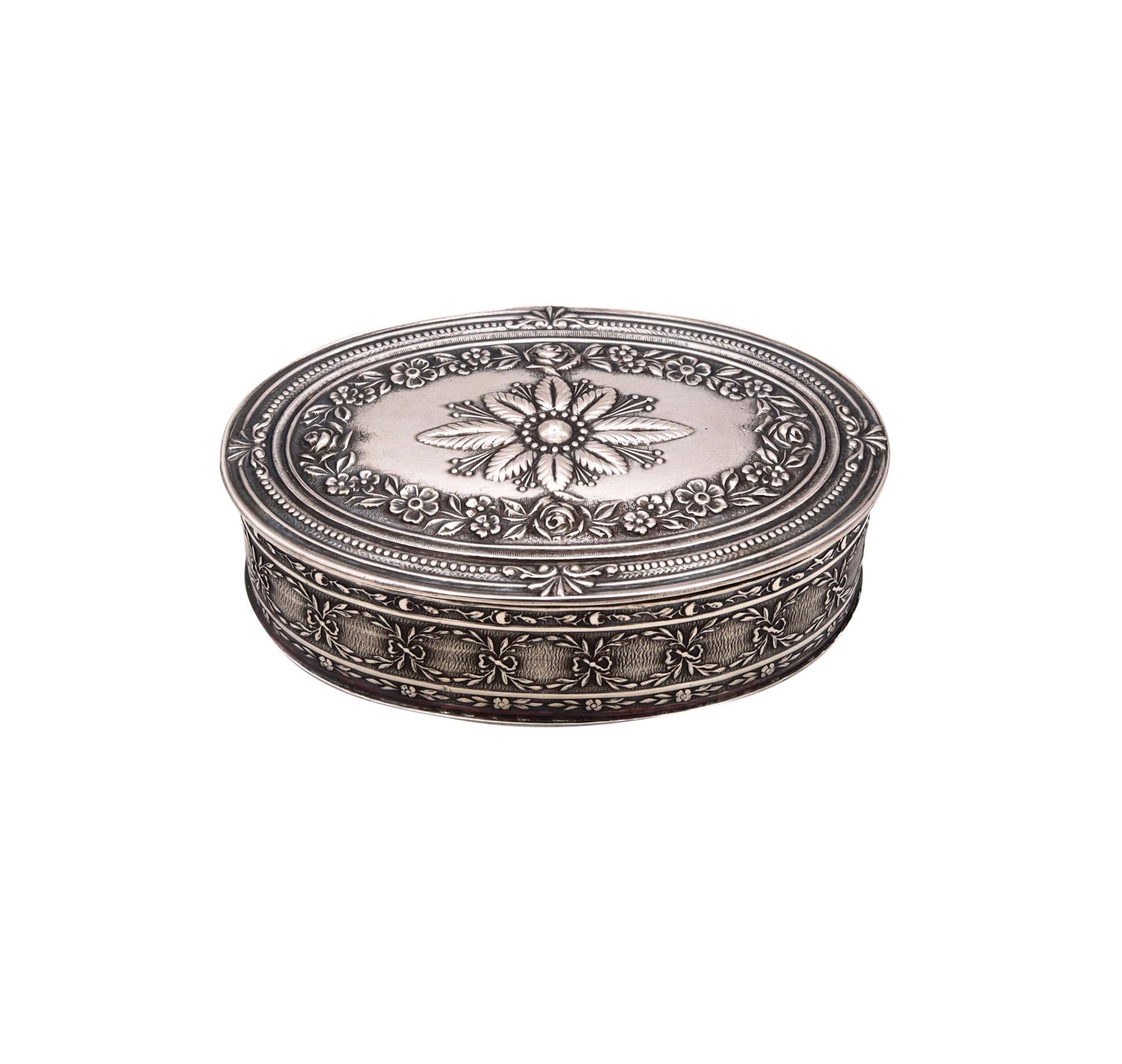 Pill box designed by Jean Puiforcat.

Beautiful three-dimensional oval box made in Paris, France, with embossed details and patterns from the neoclassical style and the Louis XVI period. It was crafted in solid .950/,999 sterling silver and suited
