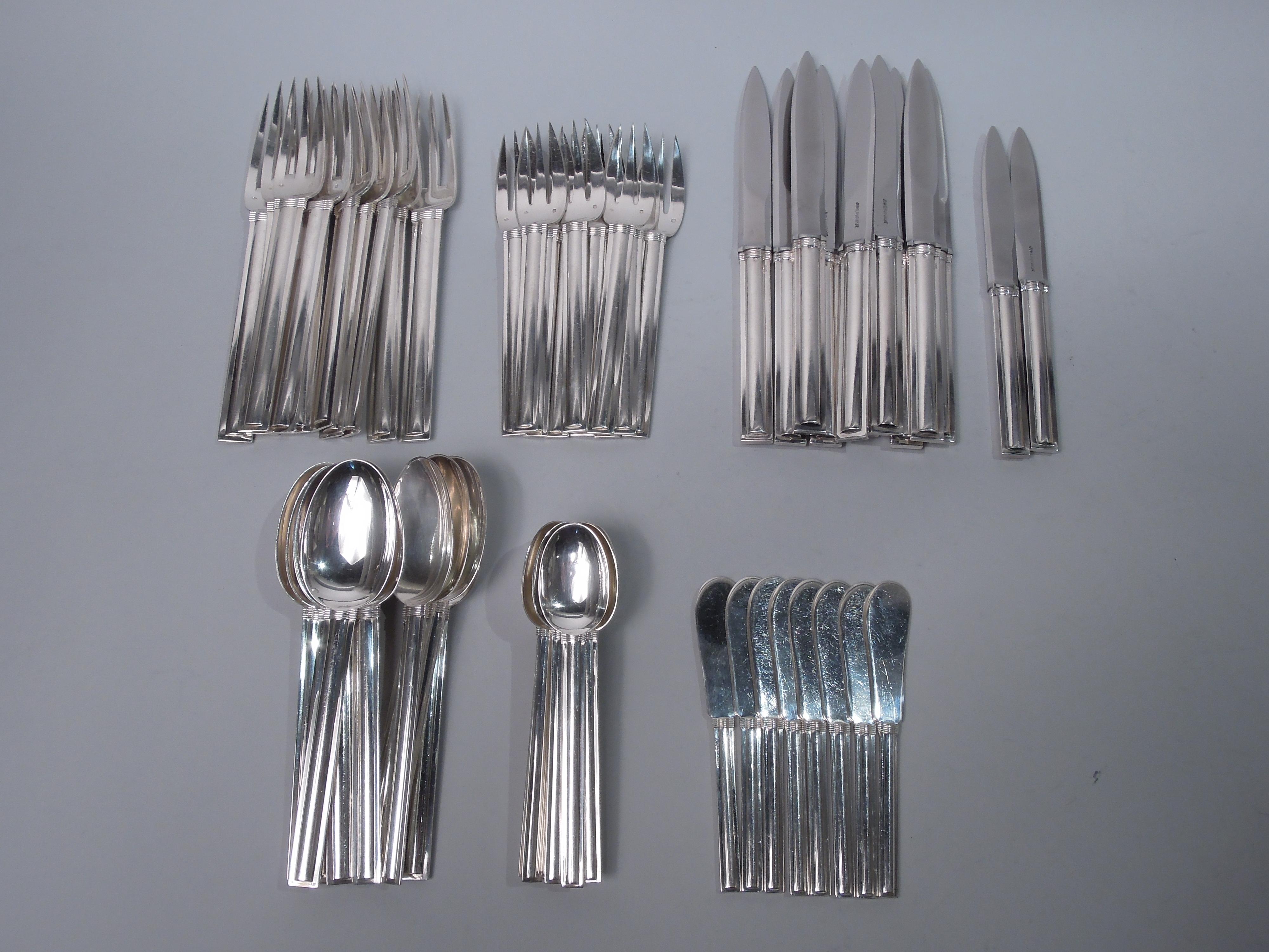 Cannes 950 silver dinner set for ten. Made by Puiforcat in France. This set comprises 60 pieces (dimensions in inches): Forks: 10 dinner forks (8) and 10 salad forks (6 7/8); Spoons: 10 teaspoons (5 7/8) and 10 dessert spoons (7); Knives: 10 dinner