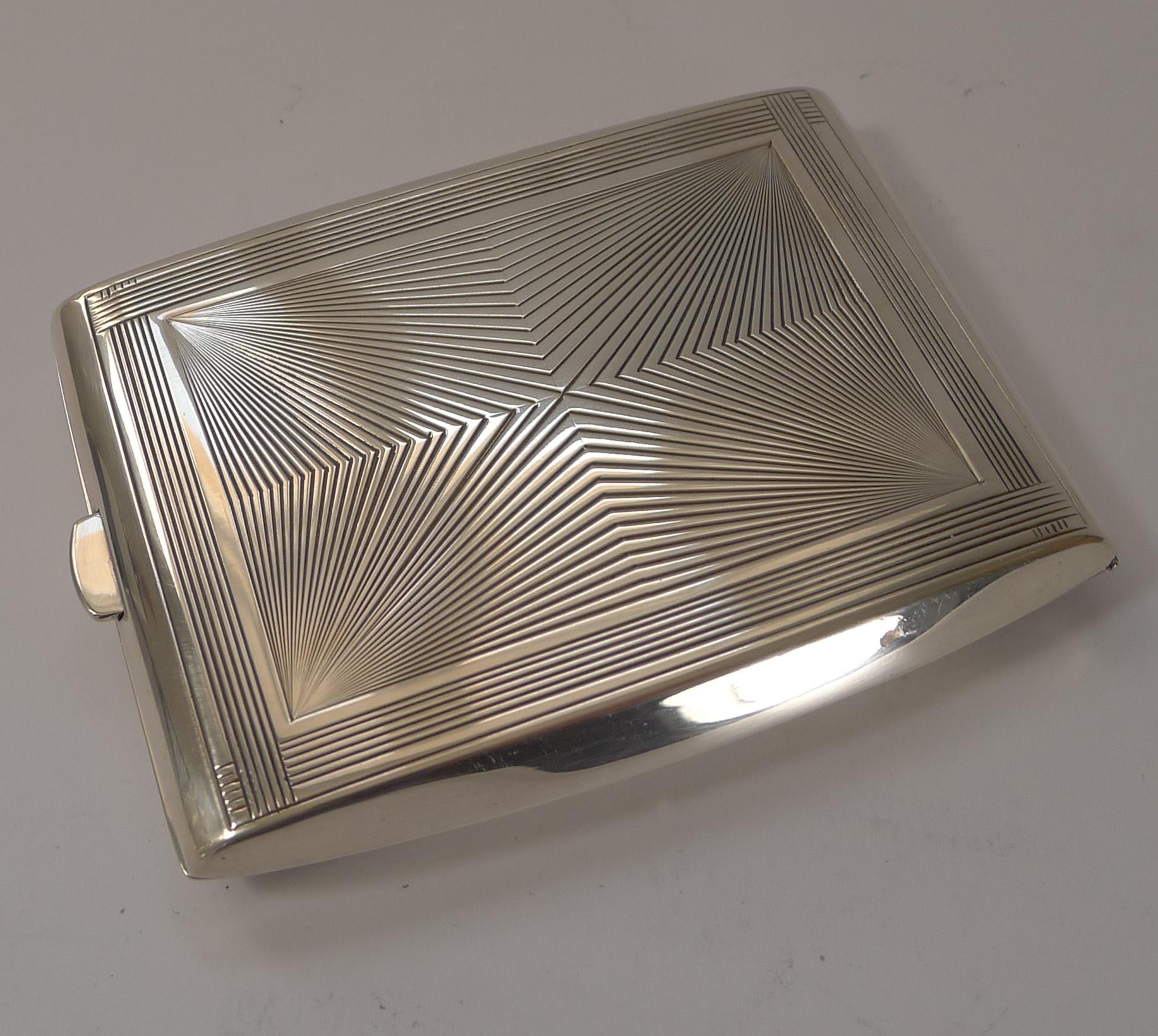 A wonderfully stylish Art Deco cigarette case by Emile Puiforcat, Paris. I have taken a couple of photographs with my business cards in, showing it is just perfect as a re-purposed work of art.

A beautiful shape with a strong Art Deco design, the