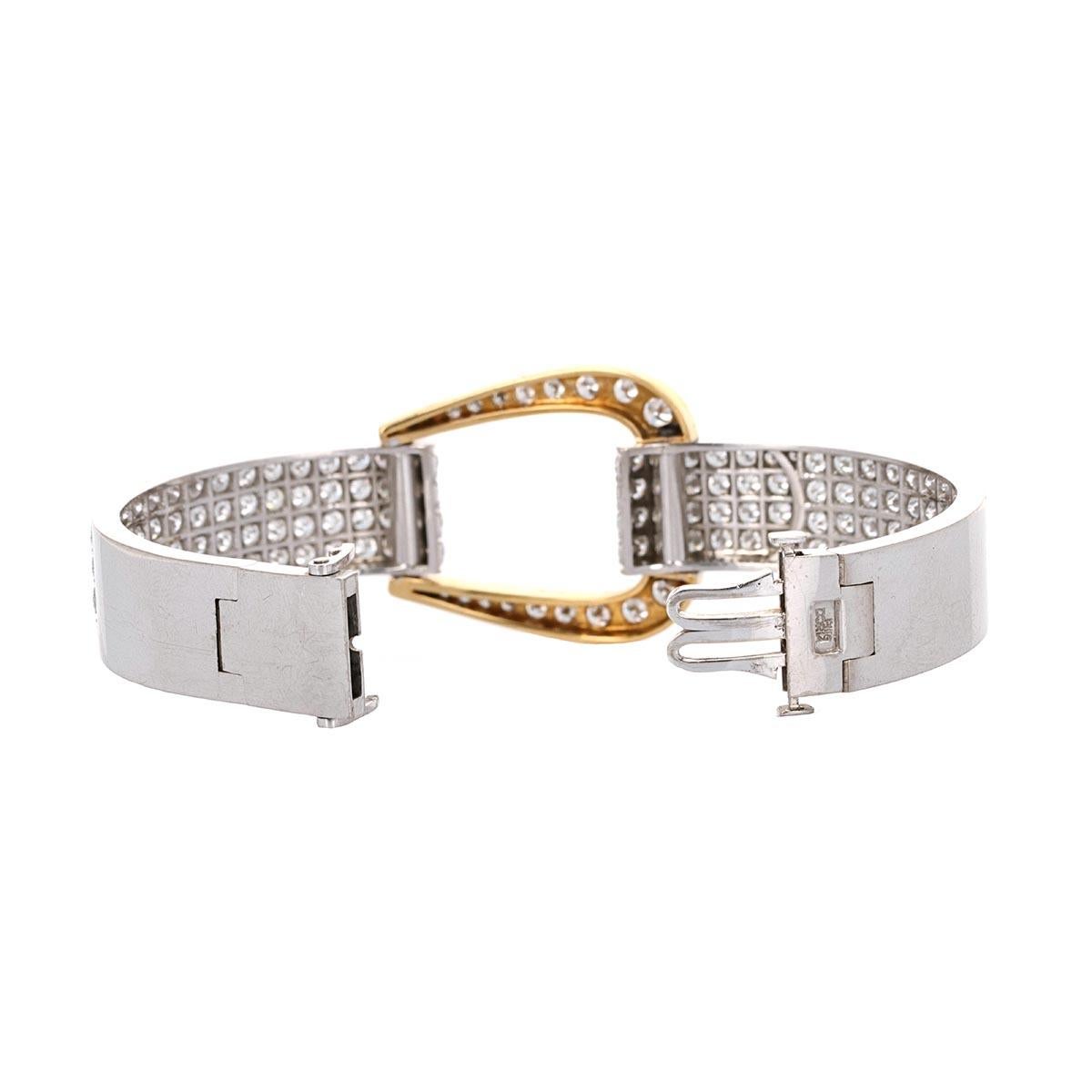 18 karat white and yellow gold diamond cuff bracelet. The bracelet is made to look like a buckle and the style is known as 