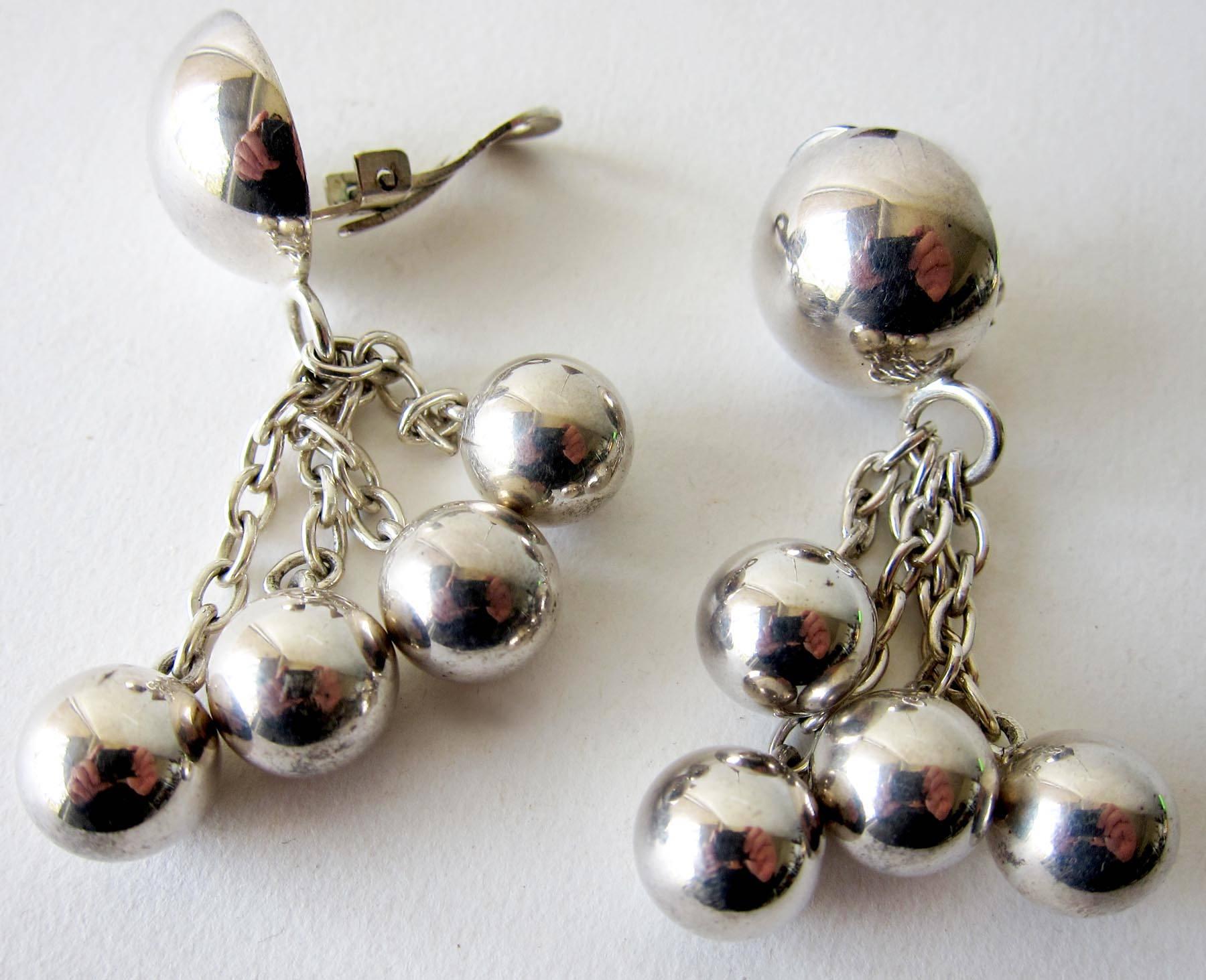 Modernist ball and chain earrings created by José Maria Puig Doria of Barcelona, Spain.  Clip back earrings make a lovely light sound when worn.  They measure 2.5