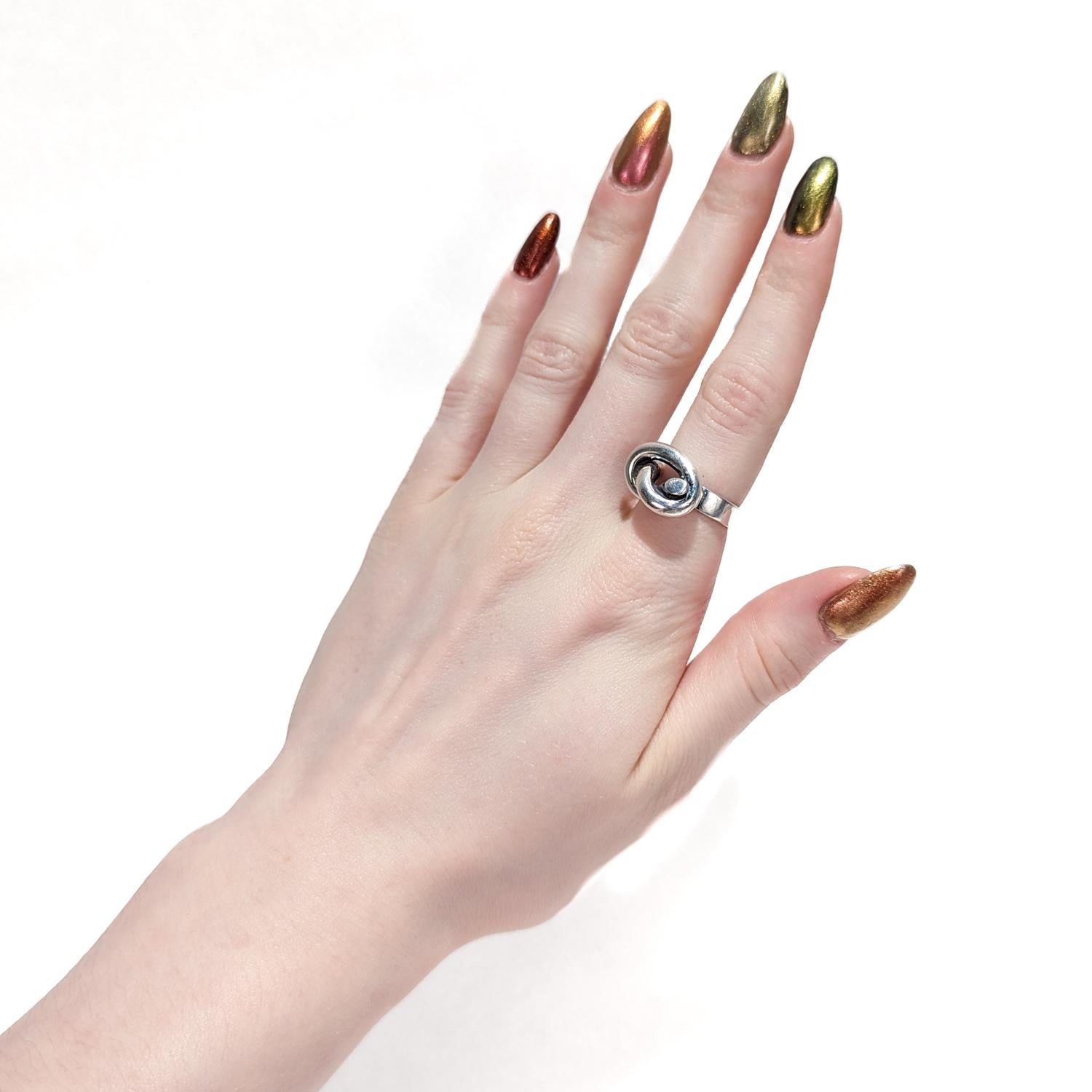 Modern Puig Doria Sterling Silver Pretzel Knot Band Ring For Sale