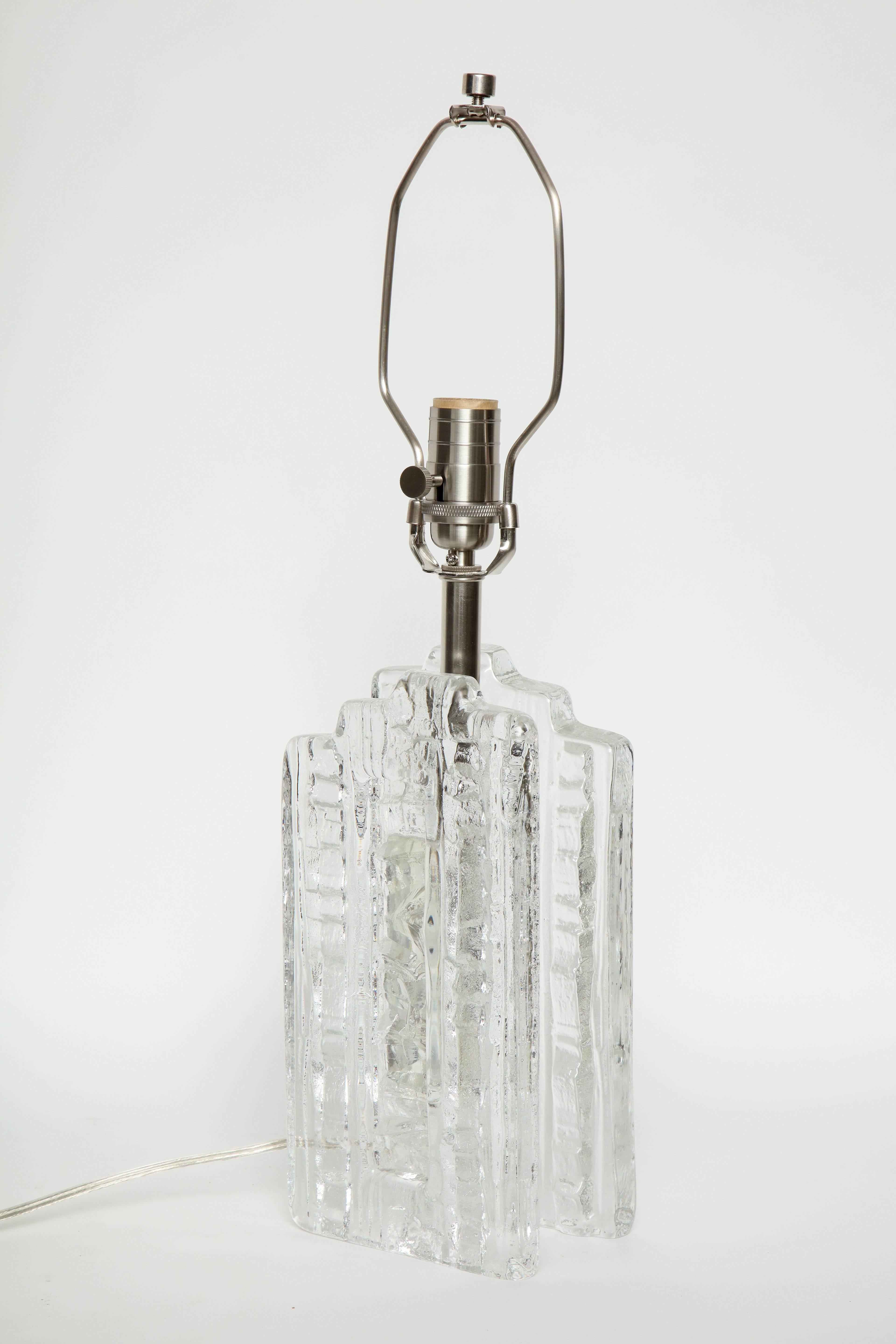 Pair of Scandinavian modern crystal panel lamps with an abstract relief pattern on front and backs. Lamps have been rewired for use in the USA.
