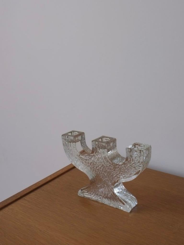 Vintage art glass three candle sticks holder from Pukeberg Glasbruk.

Additional information:
Country of manufacture: Sweden
Design/Manufacture period: 1970s
Dimensions: 18 W X 3.5 D x 13 H cm
Weight: 1120 Gr
Condition: Very good vintage condition