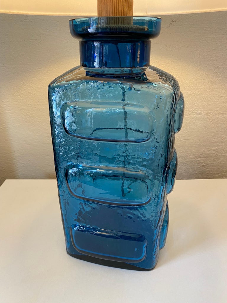 Pukeberg Glasbruk Swedish Blue Glass Table lamp. Polished Top with a wood Stopper that holds the socket. Very Nice Condition! Great Color and Design!.