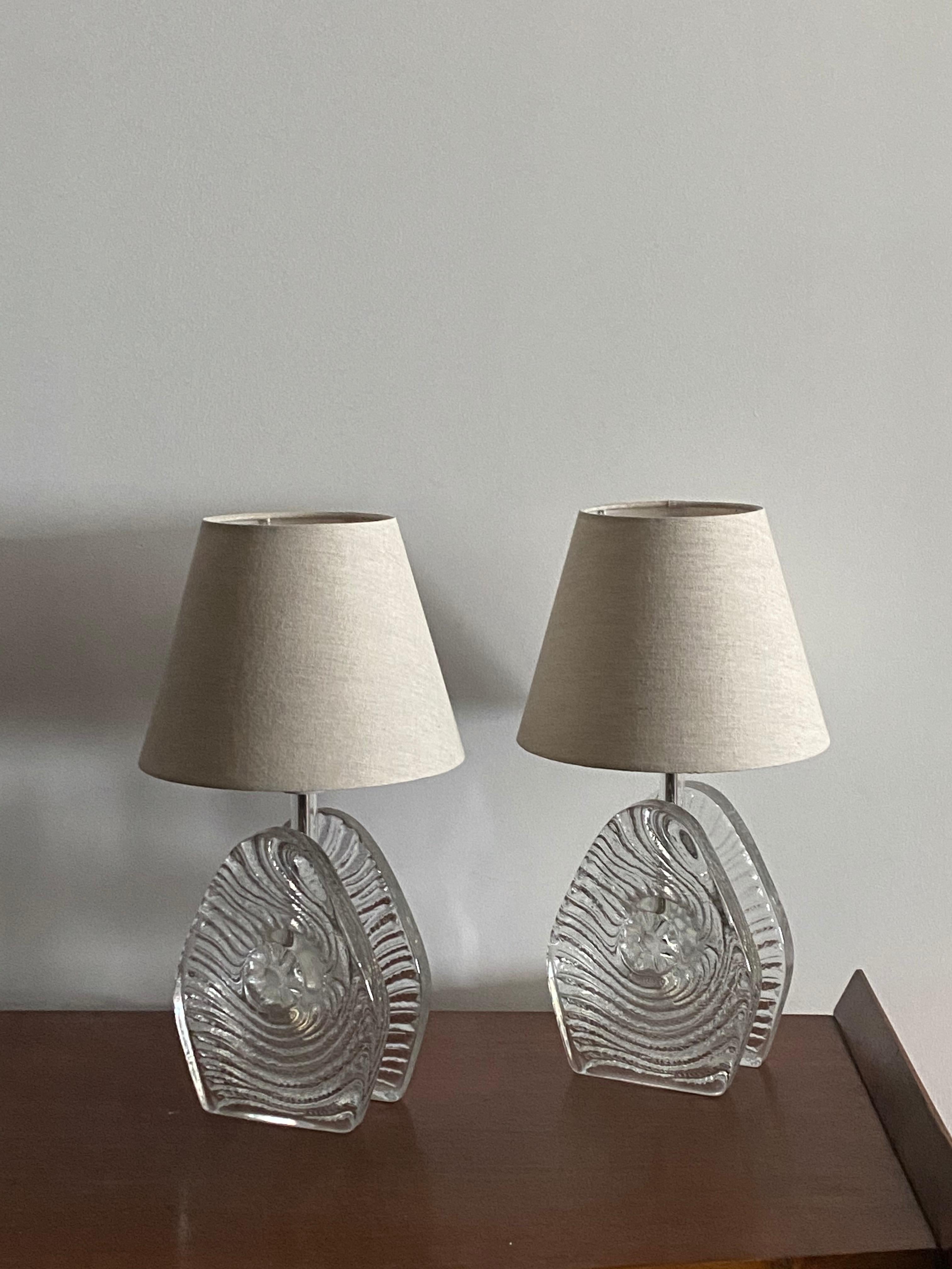 A pair of table lamps, designed and produced by Pukeberg, Sweden, 1960s. Labeled.

Lampshades in image included in purchase on request. 

Other designers of the period include Paavo Tynell, Alvar Aalto, Angelo Lelii, and Max Ingrand.
