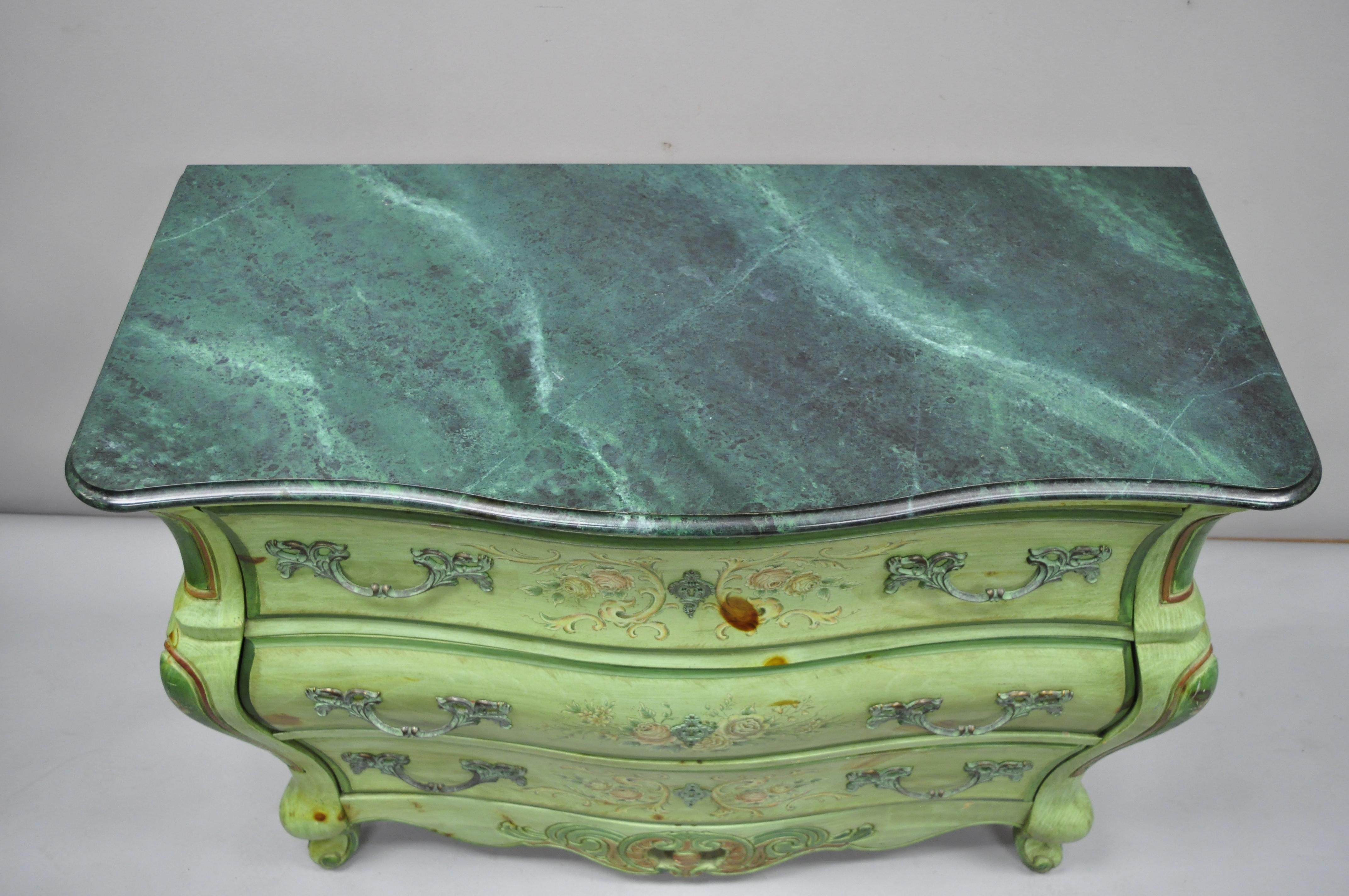 Pulaski French Louis XV style green floral painted bombe commode chest with painted faux marble top. Item features shapely bombe form, faux marble top, original green finish, floral painted details throughout, solid wood construction, 3 dovetailed