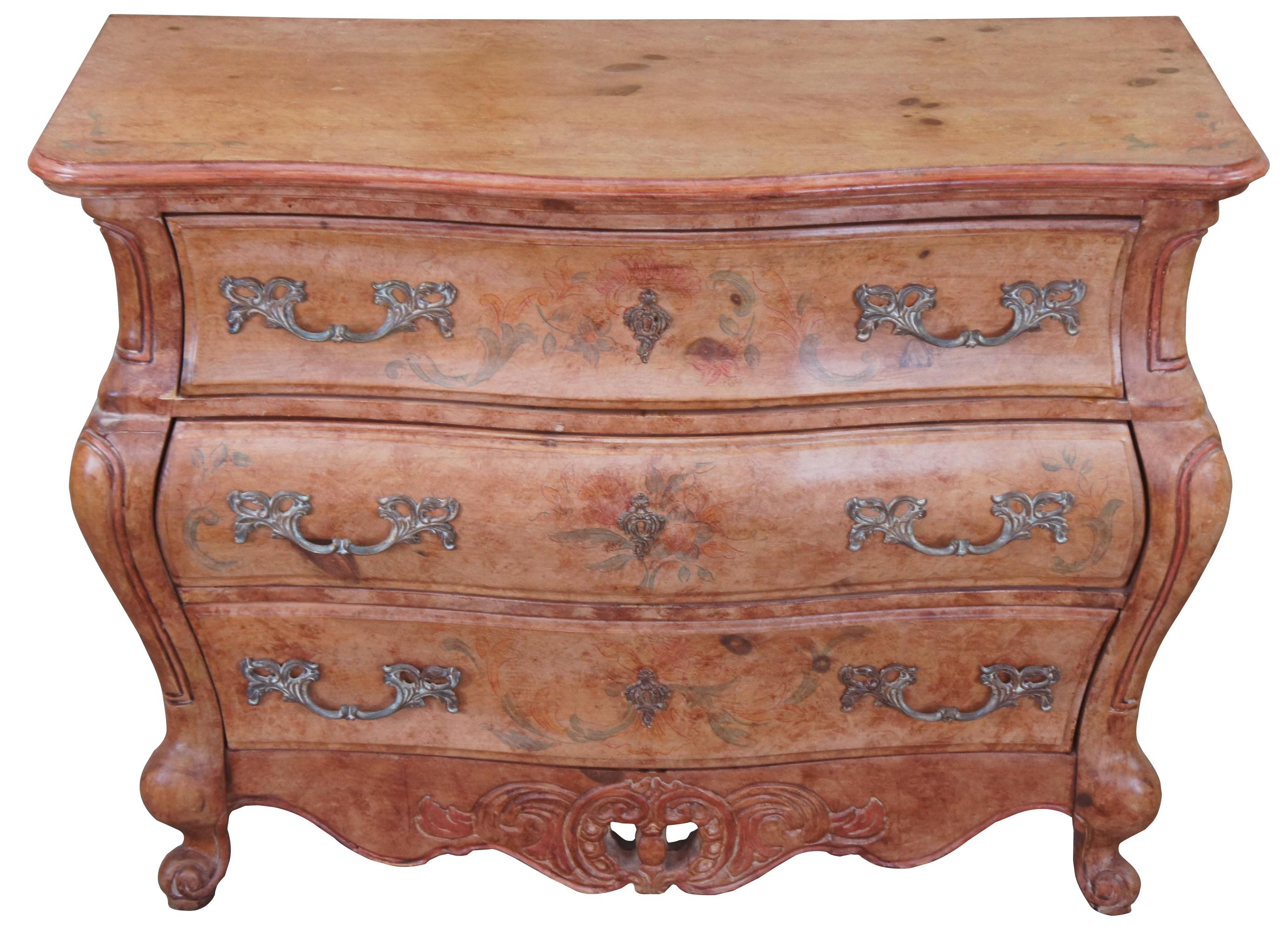 Circa 1970s Pulaski commode. Made from pine with a serpentine front a shapely bombe form. Features dovetailed drawers, floral painted accents and scrolled feet.
  