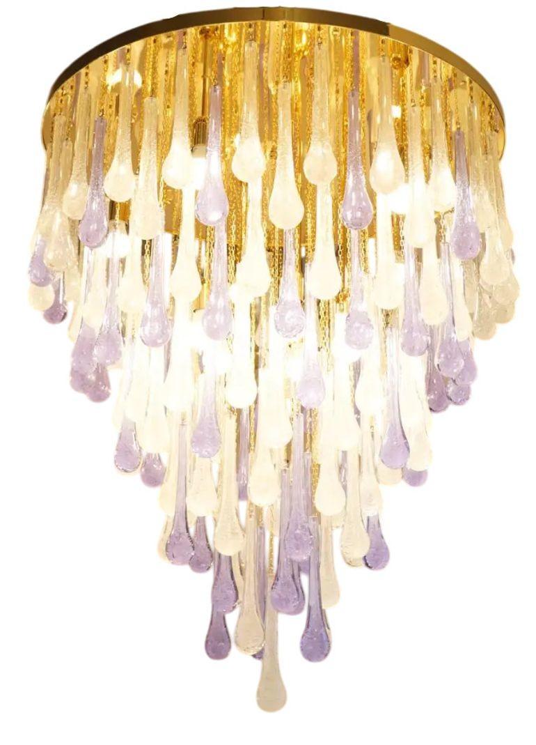 A stunning flush mount glass chandelier, designed by Franco Luce in 1980, featuring 151 hand-blown Pulegoso and Alexandrite glass drops. The organic 