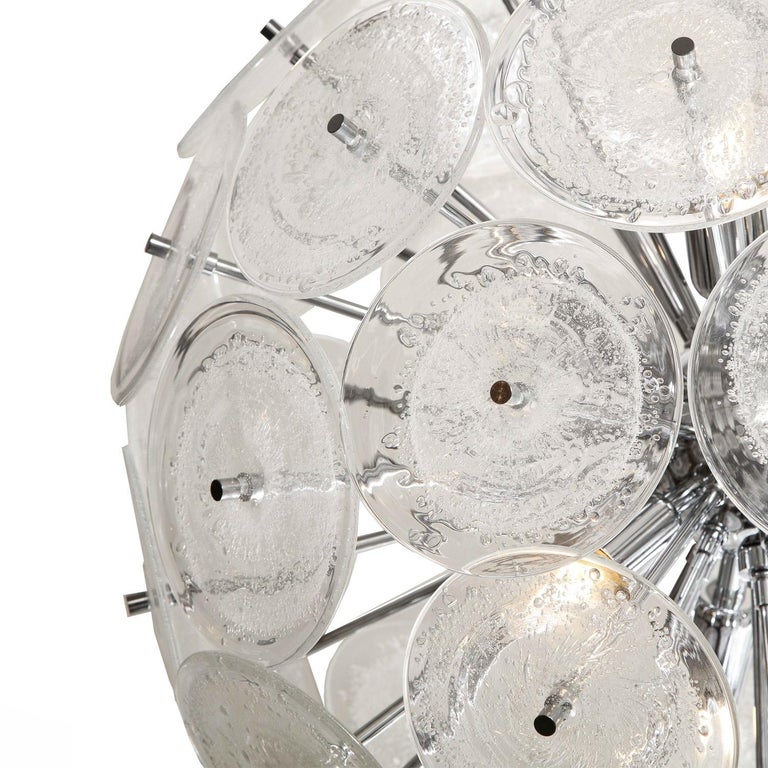 Murano clear pulegoso glass disc sputnik - style chandelier with 55 hand-crafted glass discs and chrome body. Italy, 2022.

 

 