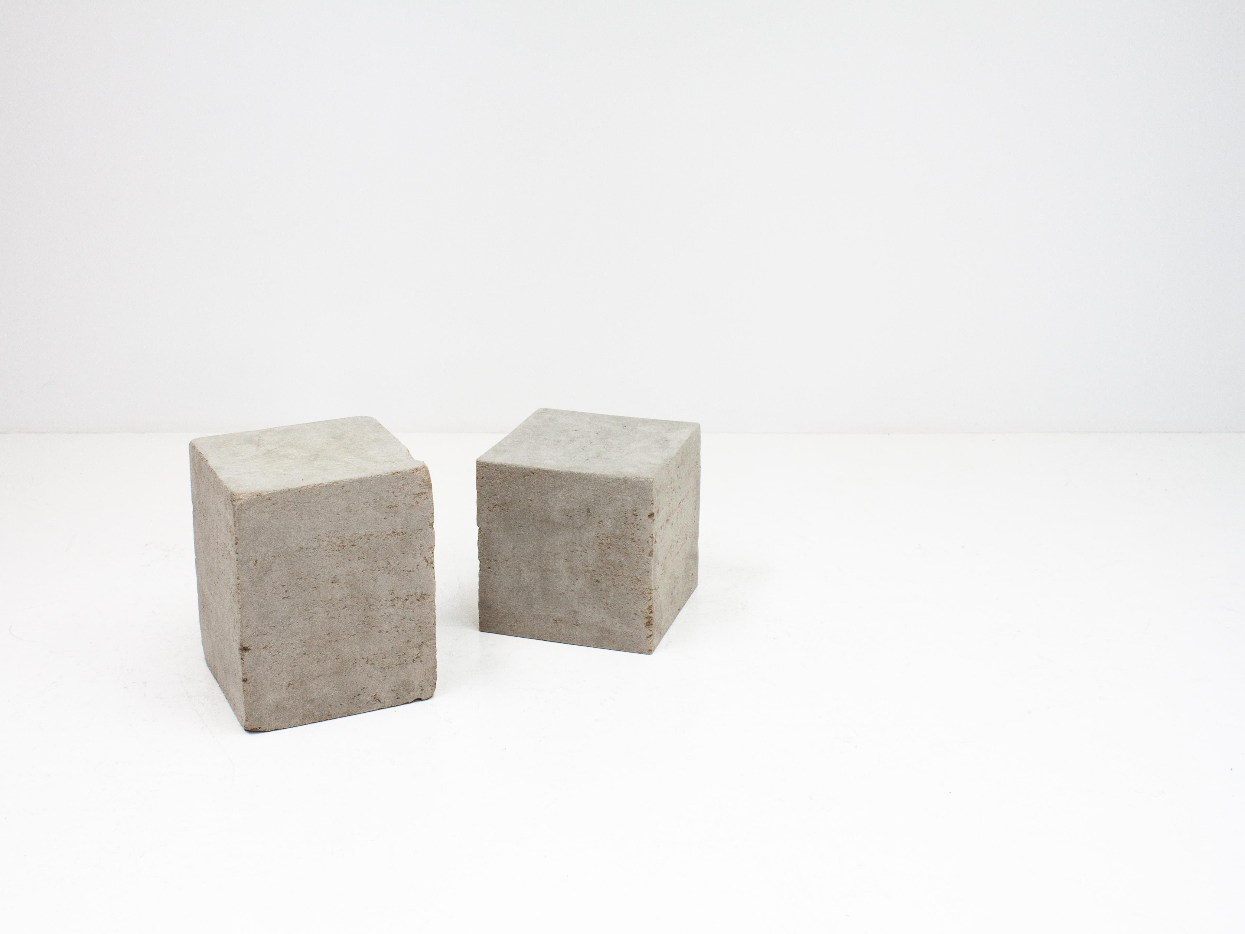 Blocks made from recycled paper pulp with the appearance of concrete.

The pulp is mixed with water and then pressed into moulds resulting in a soft tactile material that is strong and resilient – a very time-consuming artisan process with every