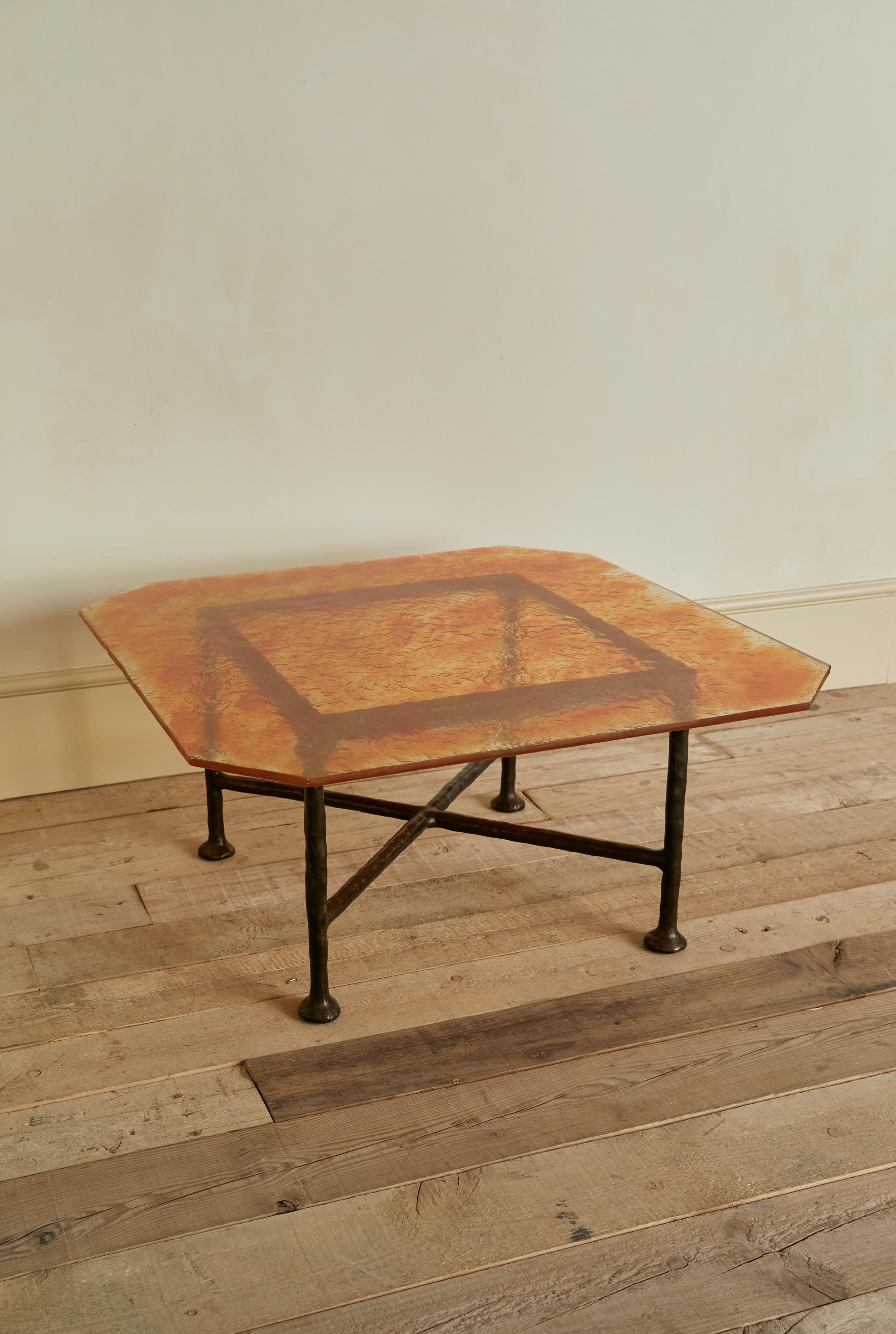 Bronze Pulver Iron table, bronze sculptured structure and handmade glass table top. For Sale