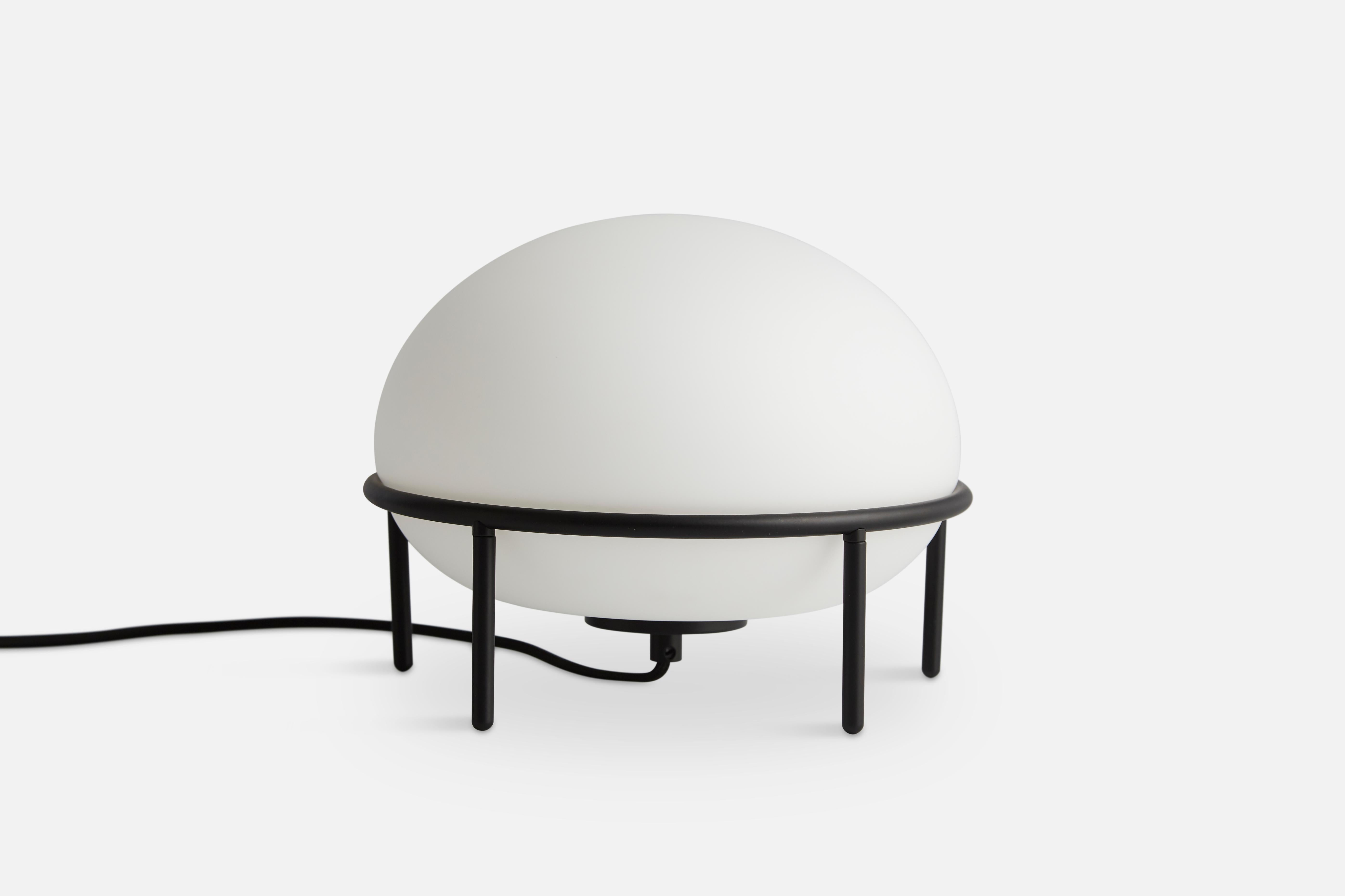 Pump table lamp by Kutarq Studio.
Materials: metal, glass.
Dimensions: D 24 x H 22 cm.

KUTARQ Studio is a multidisciplinary design studio based in Spain. The Architect and designer behind the studio, Jordi López Aguiló, designs lighting,