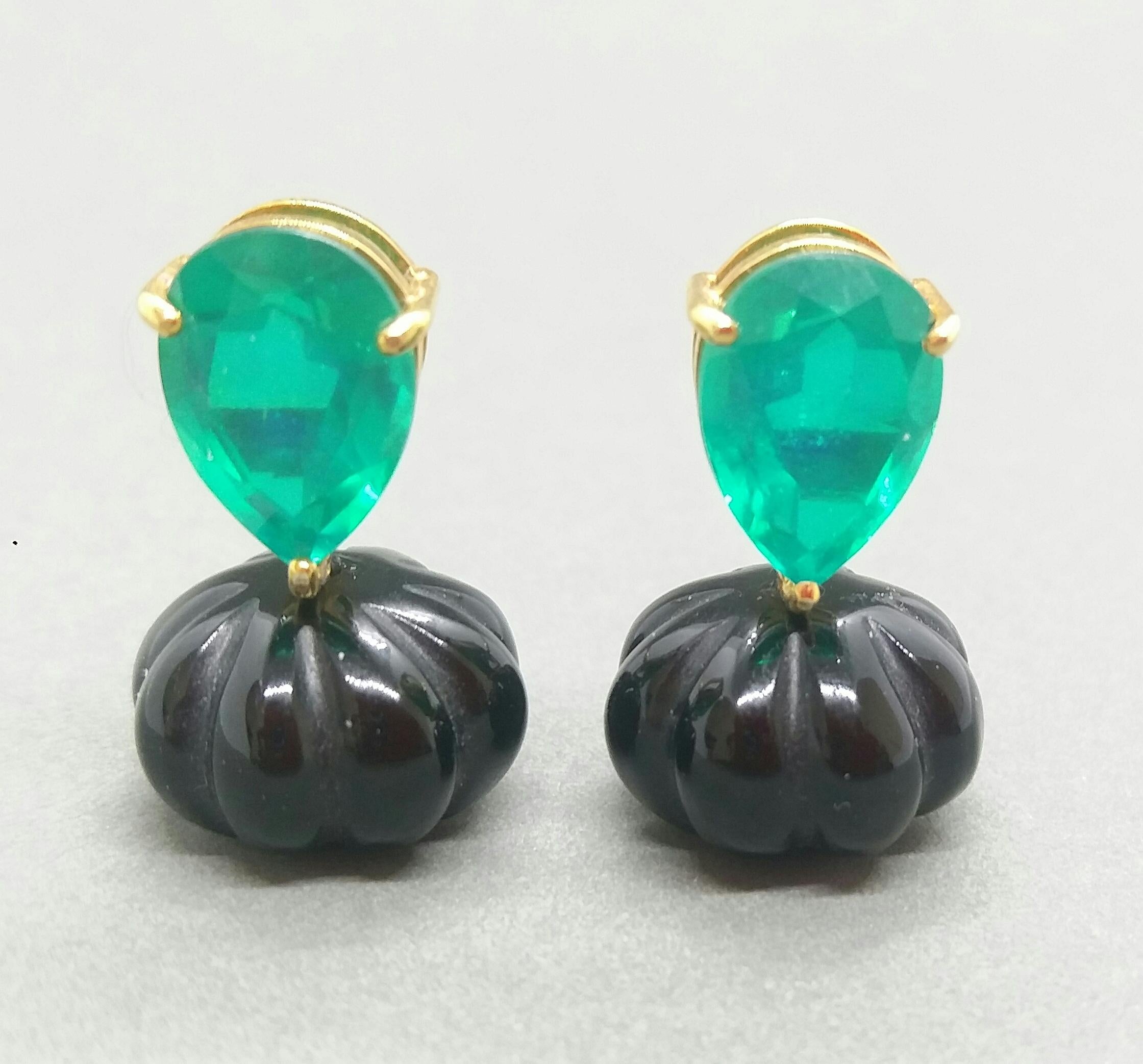 This unique and simple but elegant earrings pair is completely handmade and combines the Black Onix carved beads suspended to a couple of Pear Shape faceted Green Quartz set in solid 14 Kt. Yellow Gold

In 1978 our workshop started in Italy to make