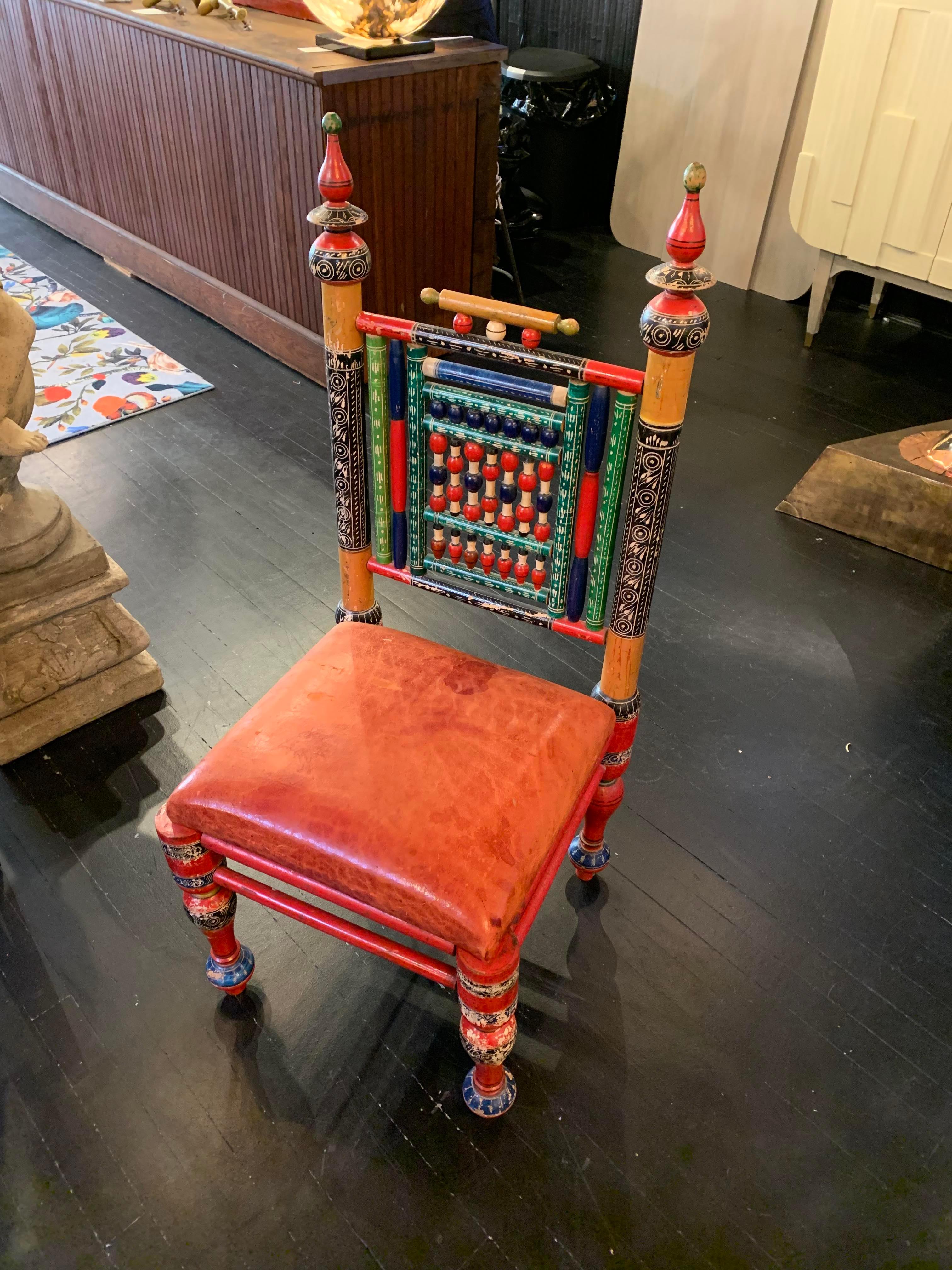 Rare set of six antique handcrafted matching Punjabi style wooden tribal chairs with original vibrant paint and aged red leather seats. Indian or Pakistani design representative of Punjabi wedding chairs but a full set of six identical chairs