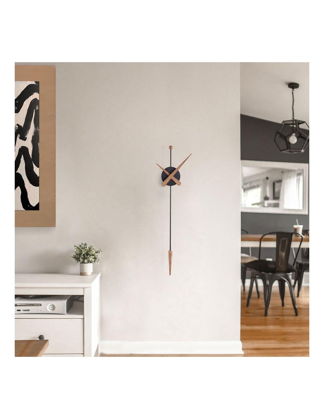A modern wall clock with an avant-garde design and a lot of character, reinterpreting the traditional pendulum clock.
Each clock is a unique handmade piece.
Material: Wood and Fiberglass. 
Warranty: Limited 2 Year.
California Residents: Prop 65
