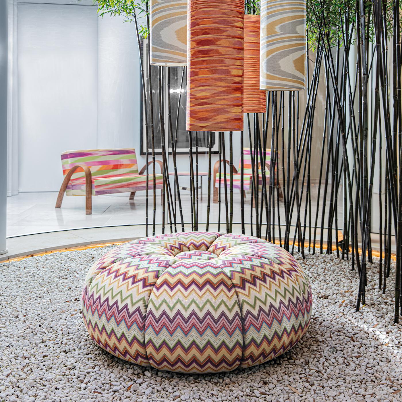 Showcasing a unique and inimitable character of bold and iconic flair, this exceptional pouf combines an inventive aesthetic with a highly comfortable shape. Inspired by the abundantly padded silhouette of a pincushion, it is composed of soft slices