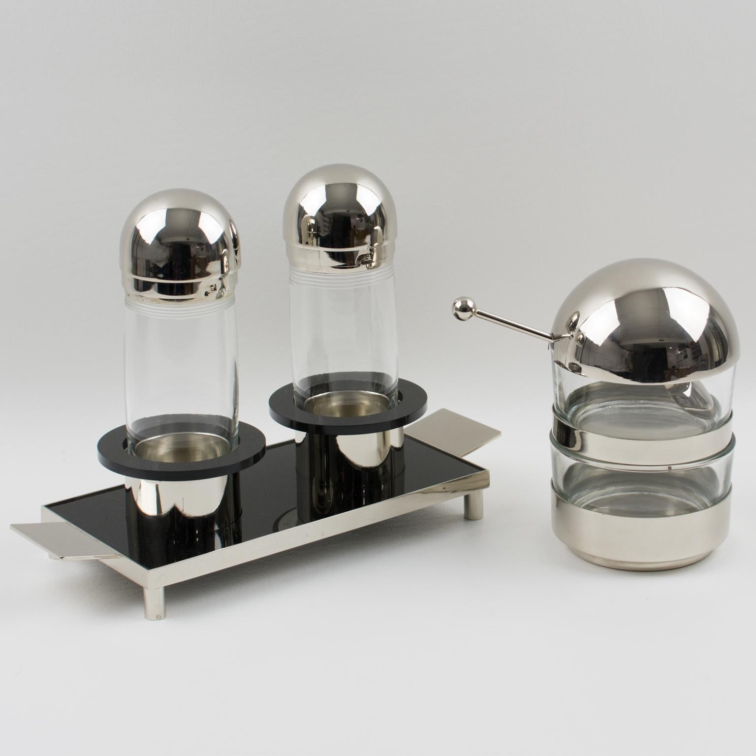 Stunning Italian modernist condiment service set. Modern form, modern design, modern material created by Punto Bacola for Montagnani, Florence, Italy, circa 1980 (Memphis period). The Set is built with oil and vinegar containers set on a serving