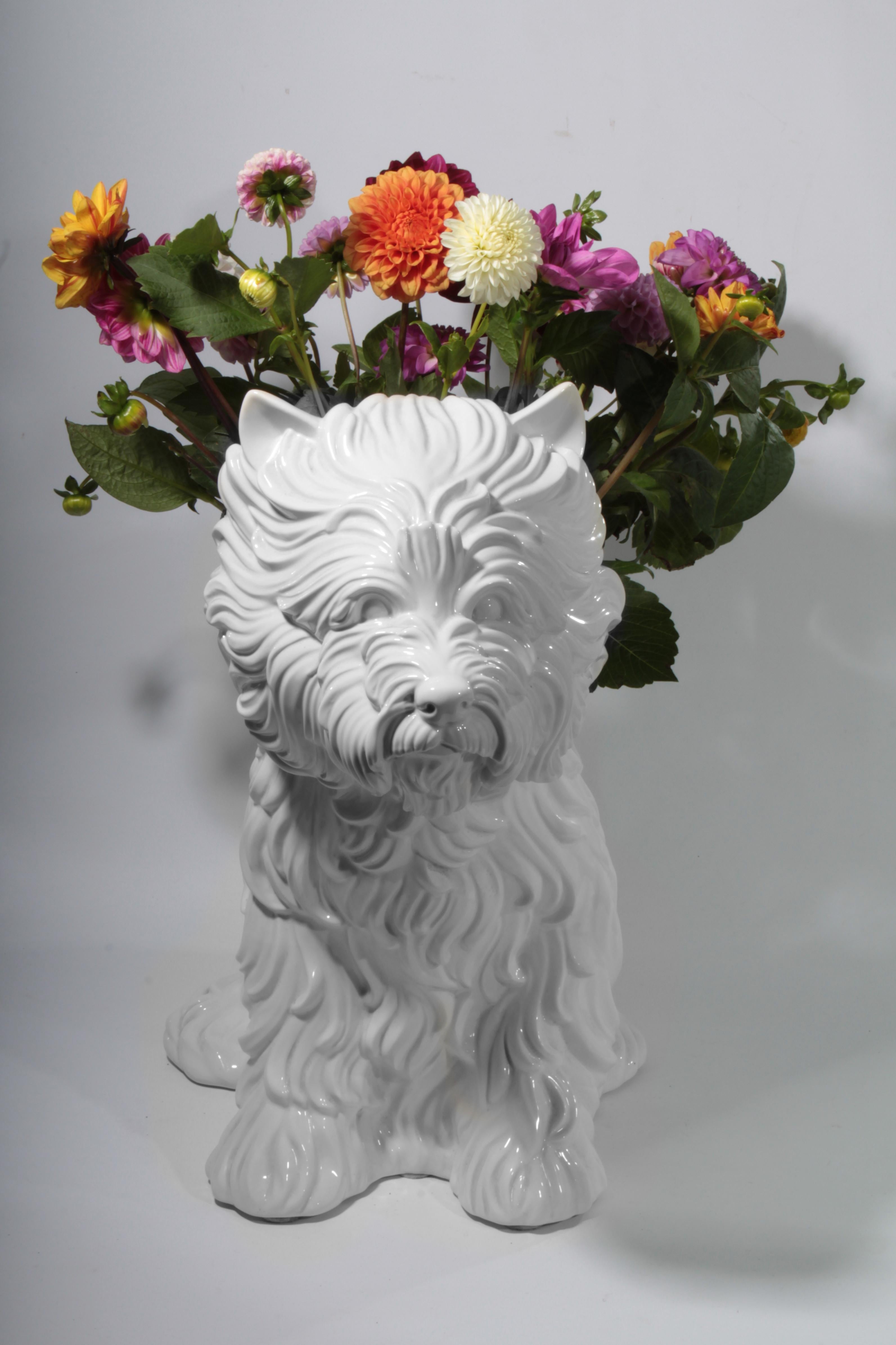 Jeff Koons puppy vase made from white glazed porcelain. The design took cues from Koons’s mongo-sized puppy sculpture (1992), which was filled with over seventeen thousand flowers. “The vase is a symbol of love, warmth, and happiness,” says Koons.