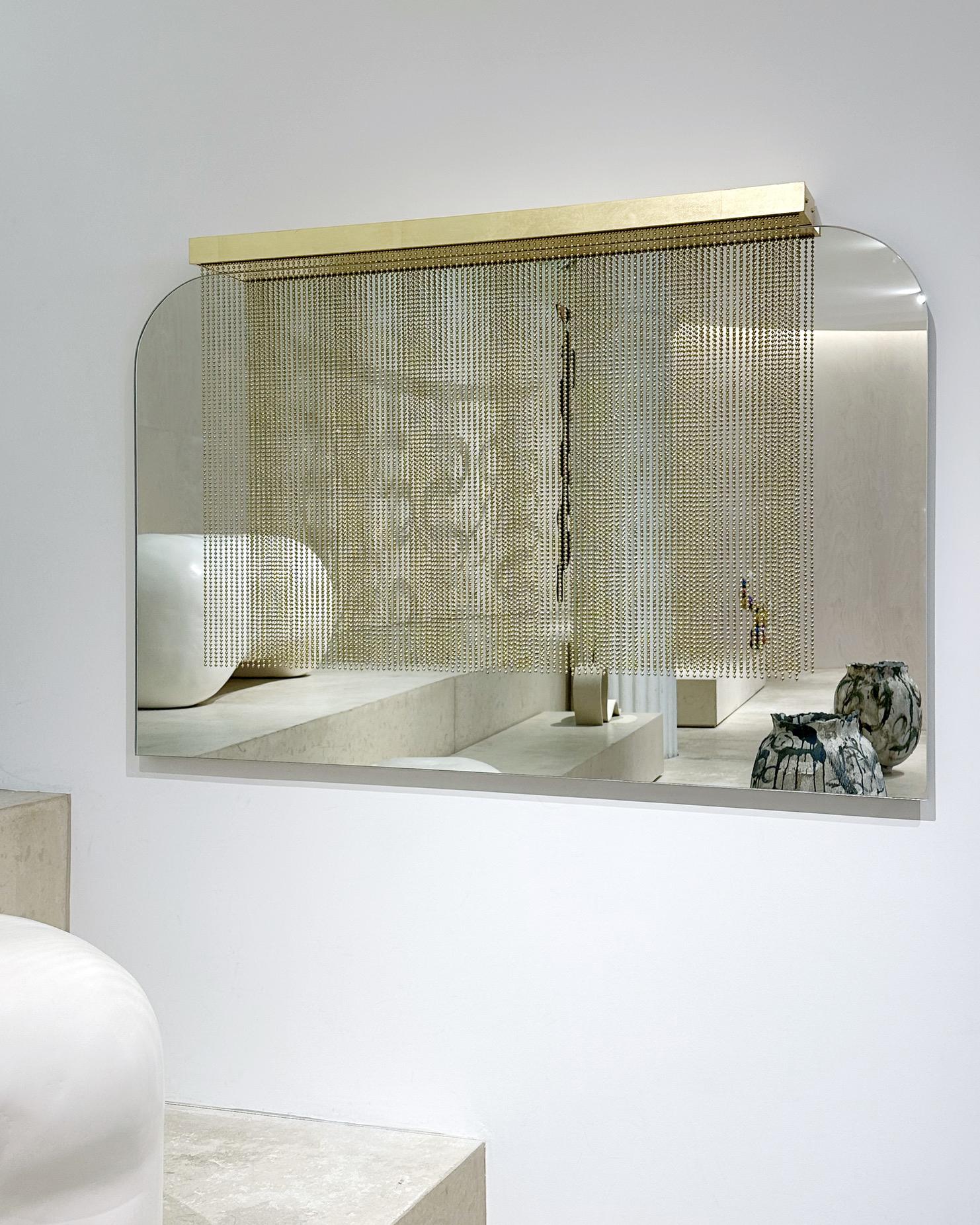 Purdah Large Mirror by Indo Made
Dimensions: D 10.2 x W 121.9 x H 76.2 cm.
Materials: Satin brass, mirrored glass and gold leaf.

Each piece is carefully handcrafted by our team using natural materials and traditional processes. Slight variations